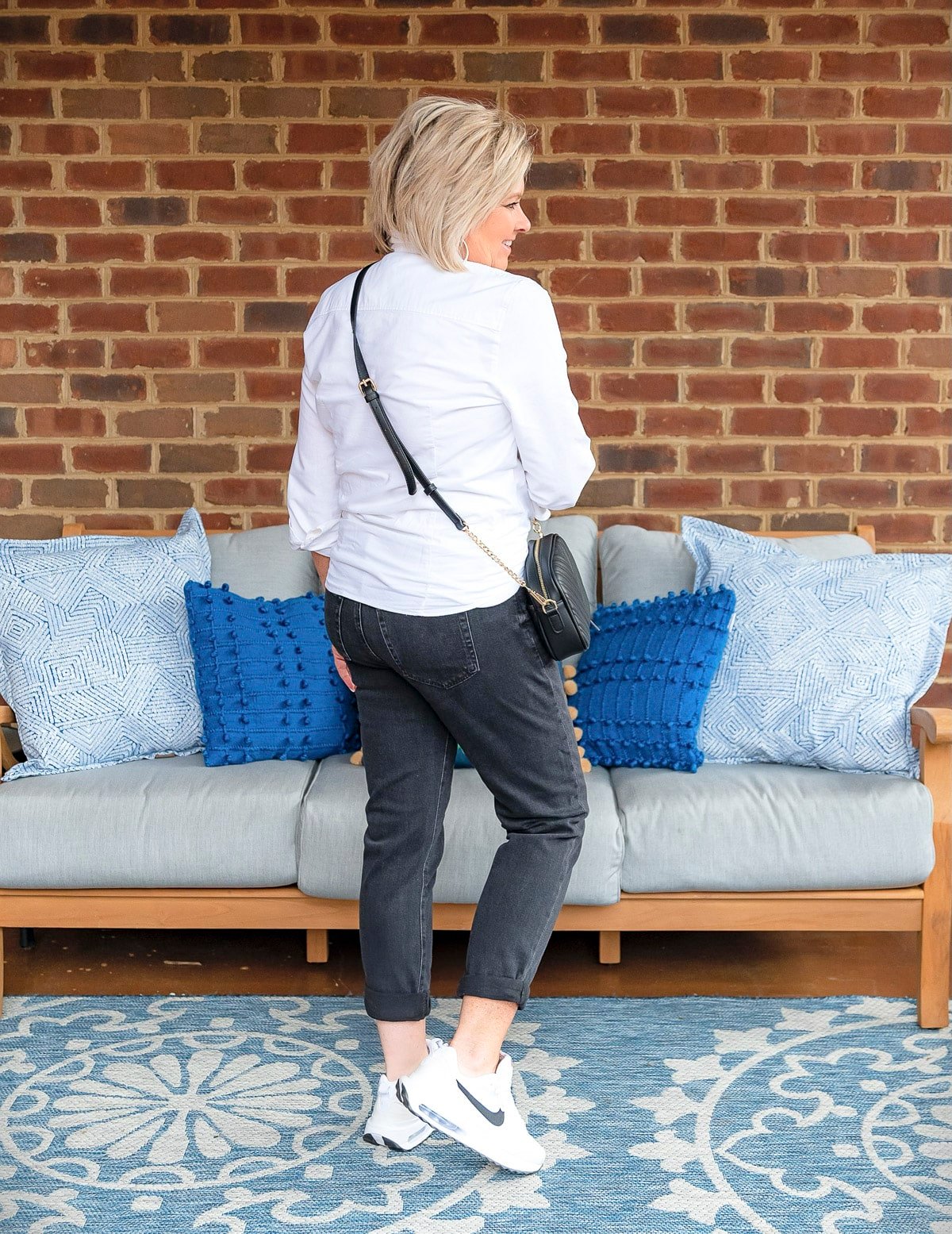 Fashion Blogger, 50 Is Not Old is showing ways to style a white button up shirt with black jeans36