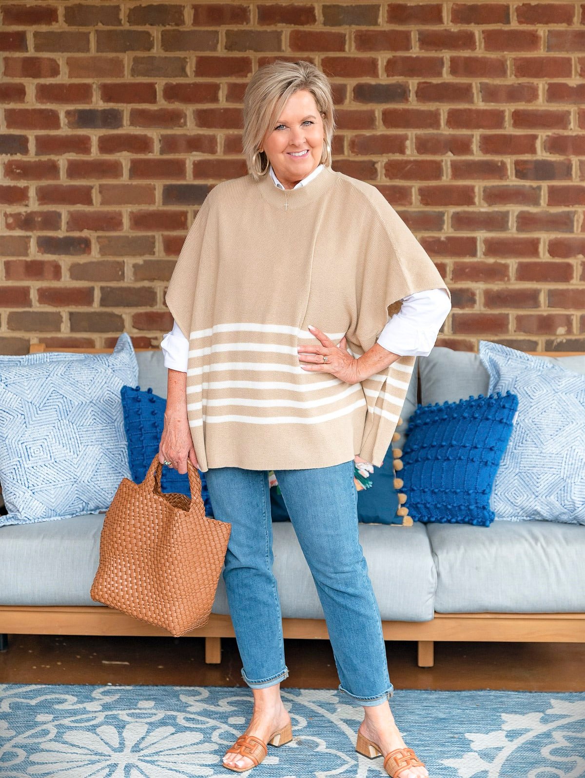 Fashion Blogger, 50 Is Not Old is showing ways to style a white button up shirt with a poncho8