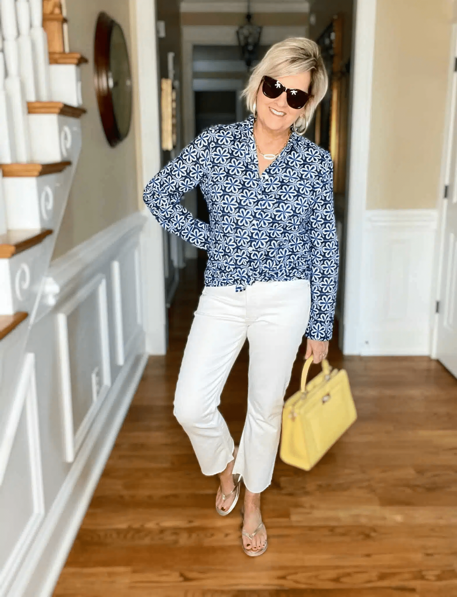 Tania Stephens is showing how to style white jeans with a blue print shirt.