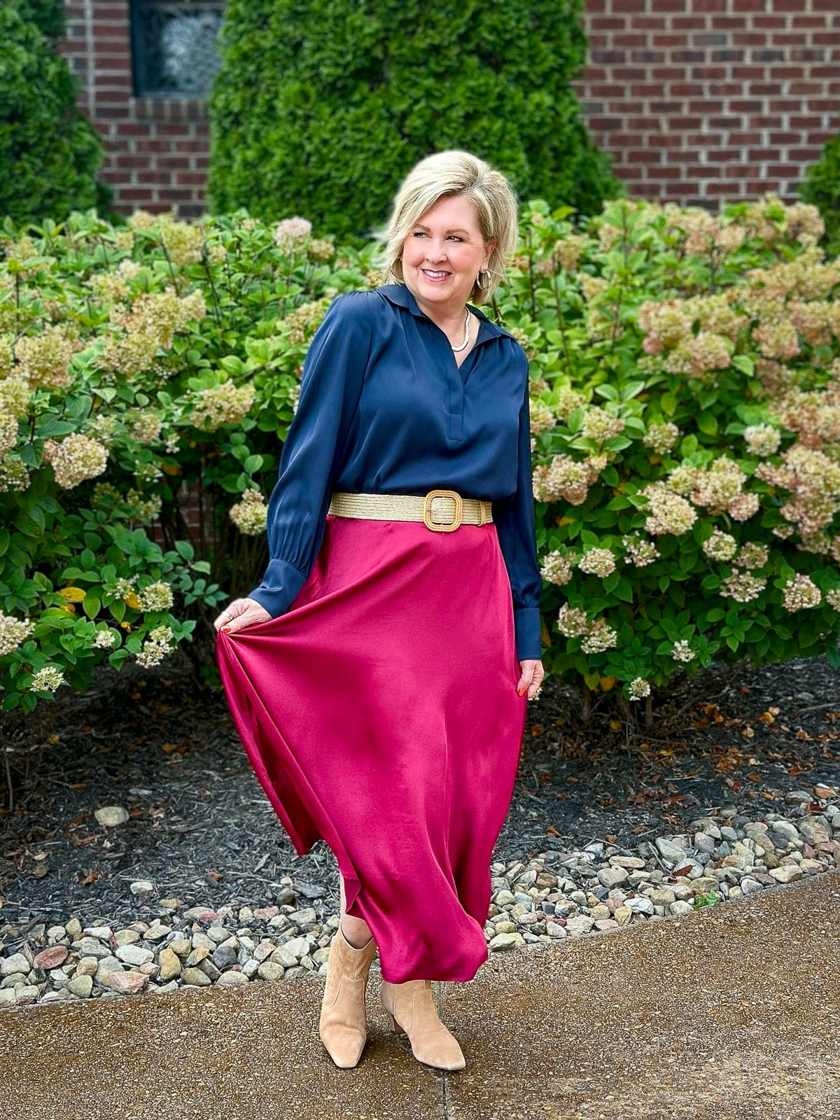 Tania Stephens is wearing navy and a pink satin skirt