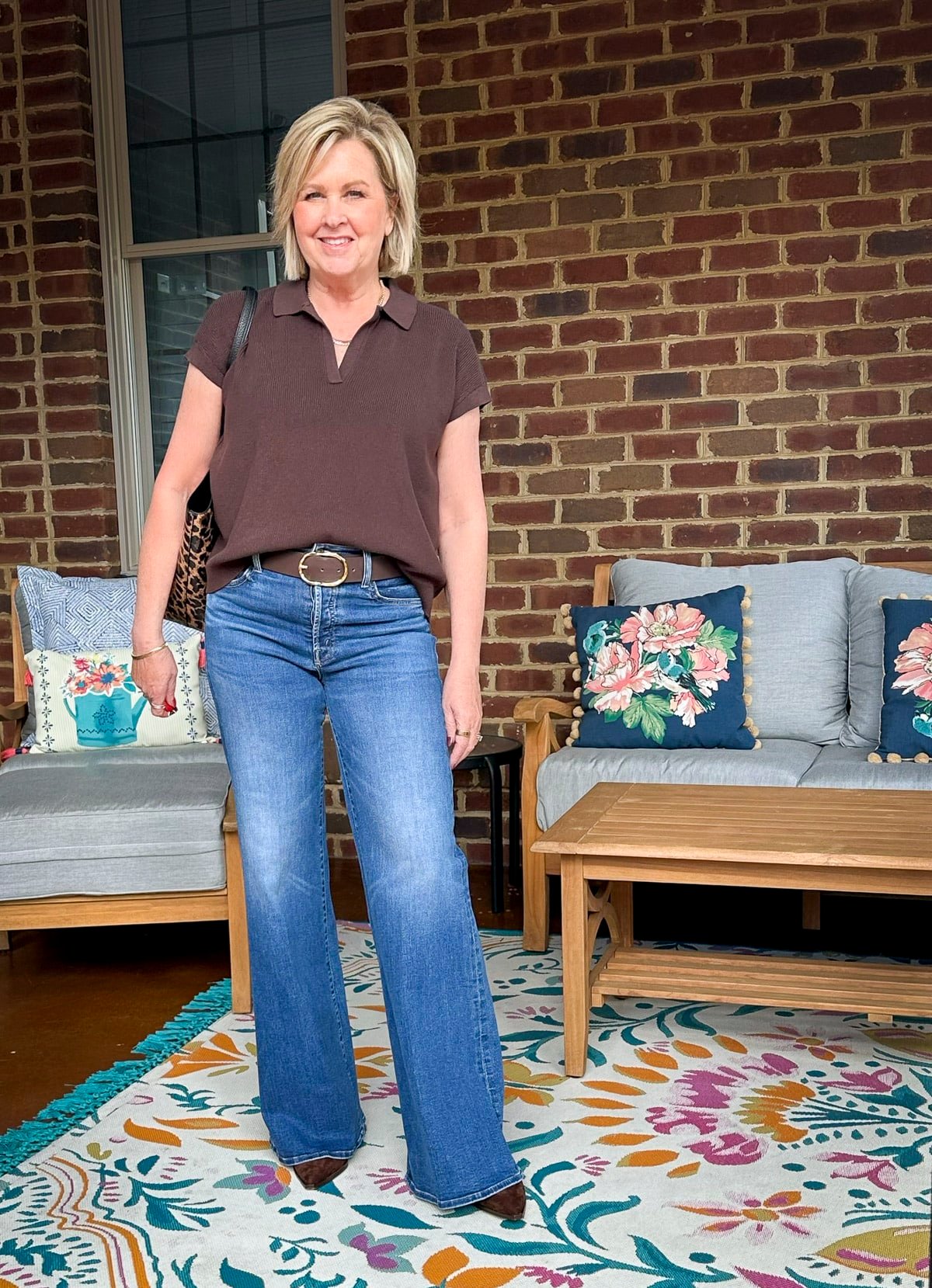 Tania Stephens is wearing Mother wide leg jeans and a Tuckernuck brown sweater