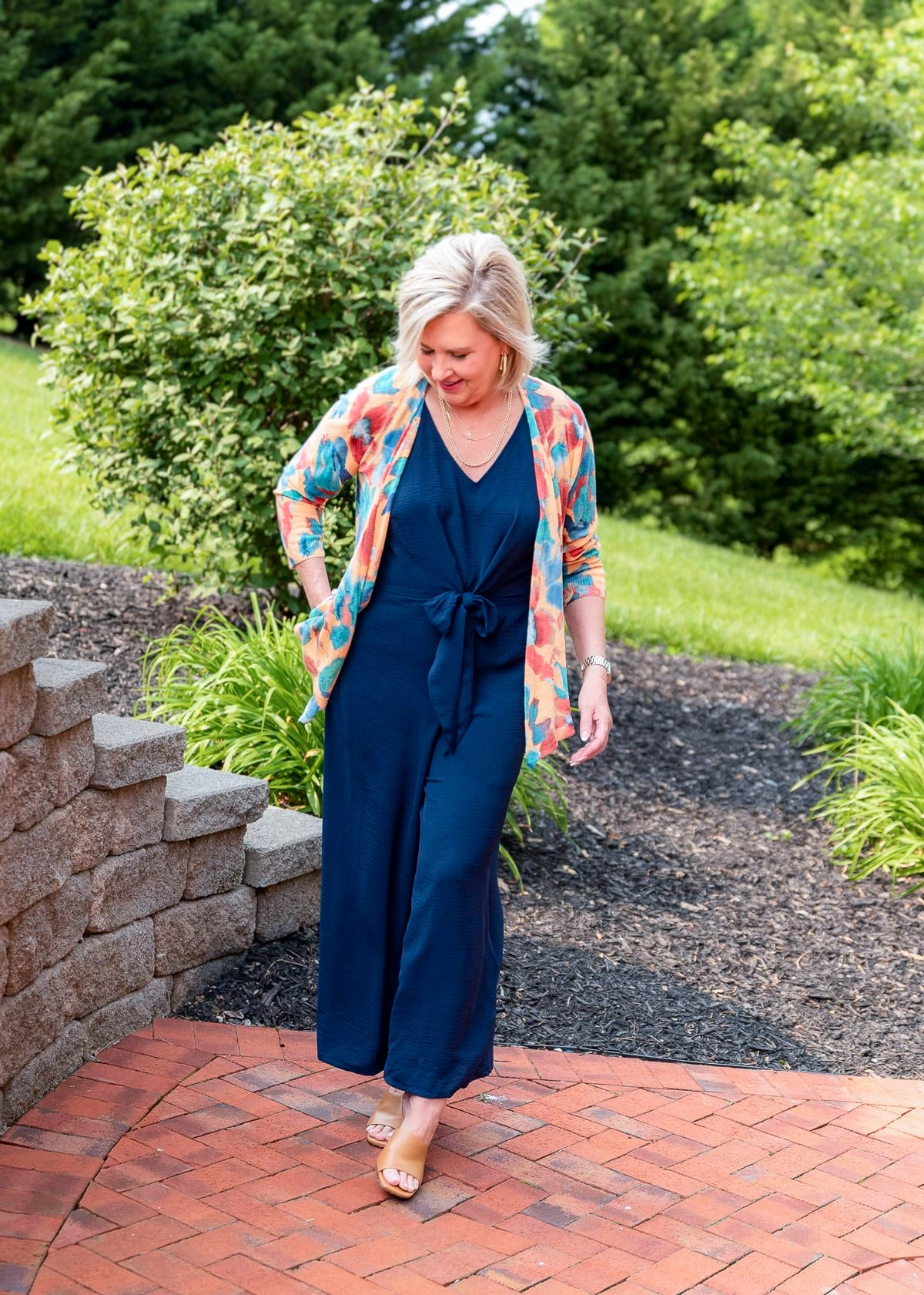 Over 50 Fashion Blogger, Tania Stephens is showing to cover flabby arms wearing a jumpsuit from Nordstrom