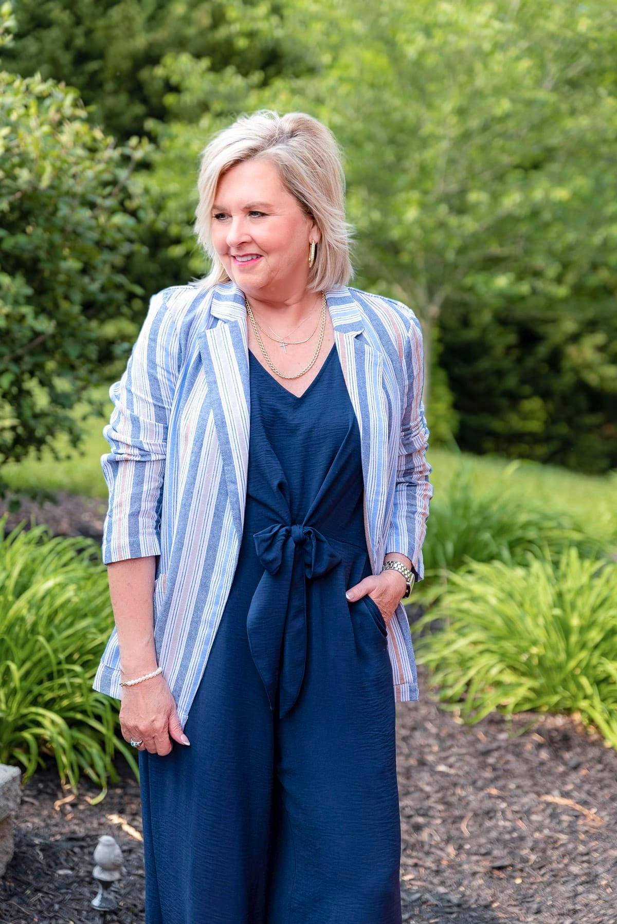 Over 50 Fashion Blogger, Tania Stephens is showing stylish ways to cover your arms wearing a jumpsuit11