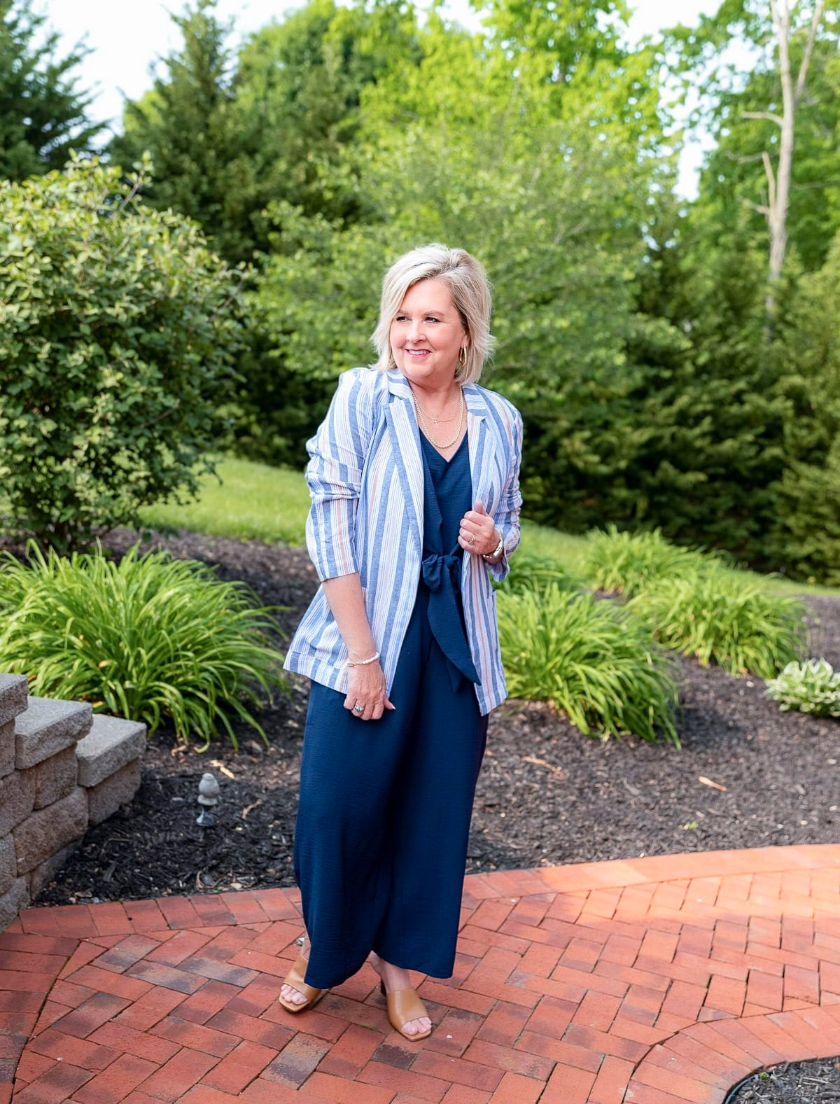 Over 50 Fashion Blogger, Tania Stephens is showing how to cover flabby arms wearing a jumpsuit13