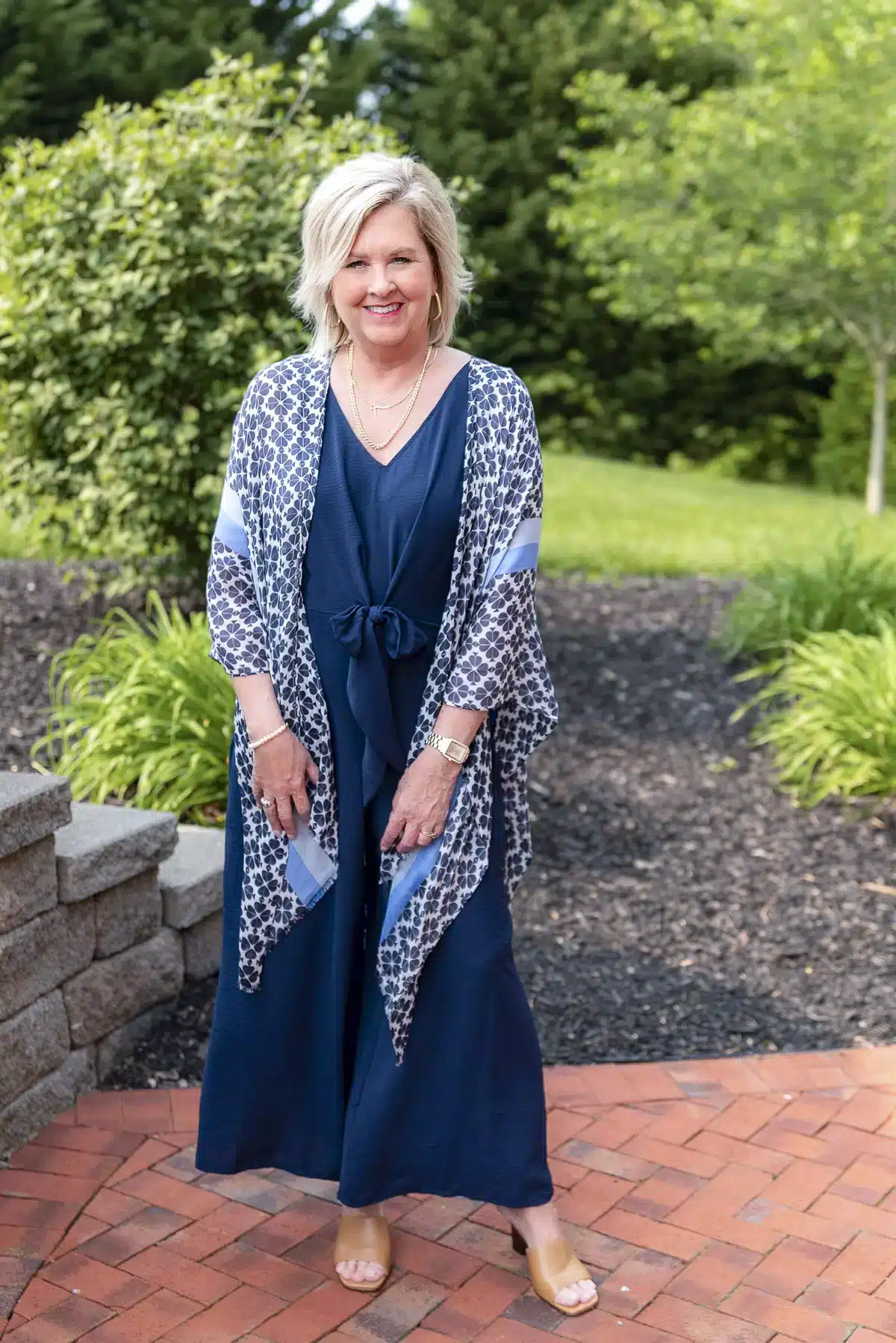 Tania Stephens showing a navy scarf over a navy jumpsuit.
