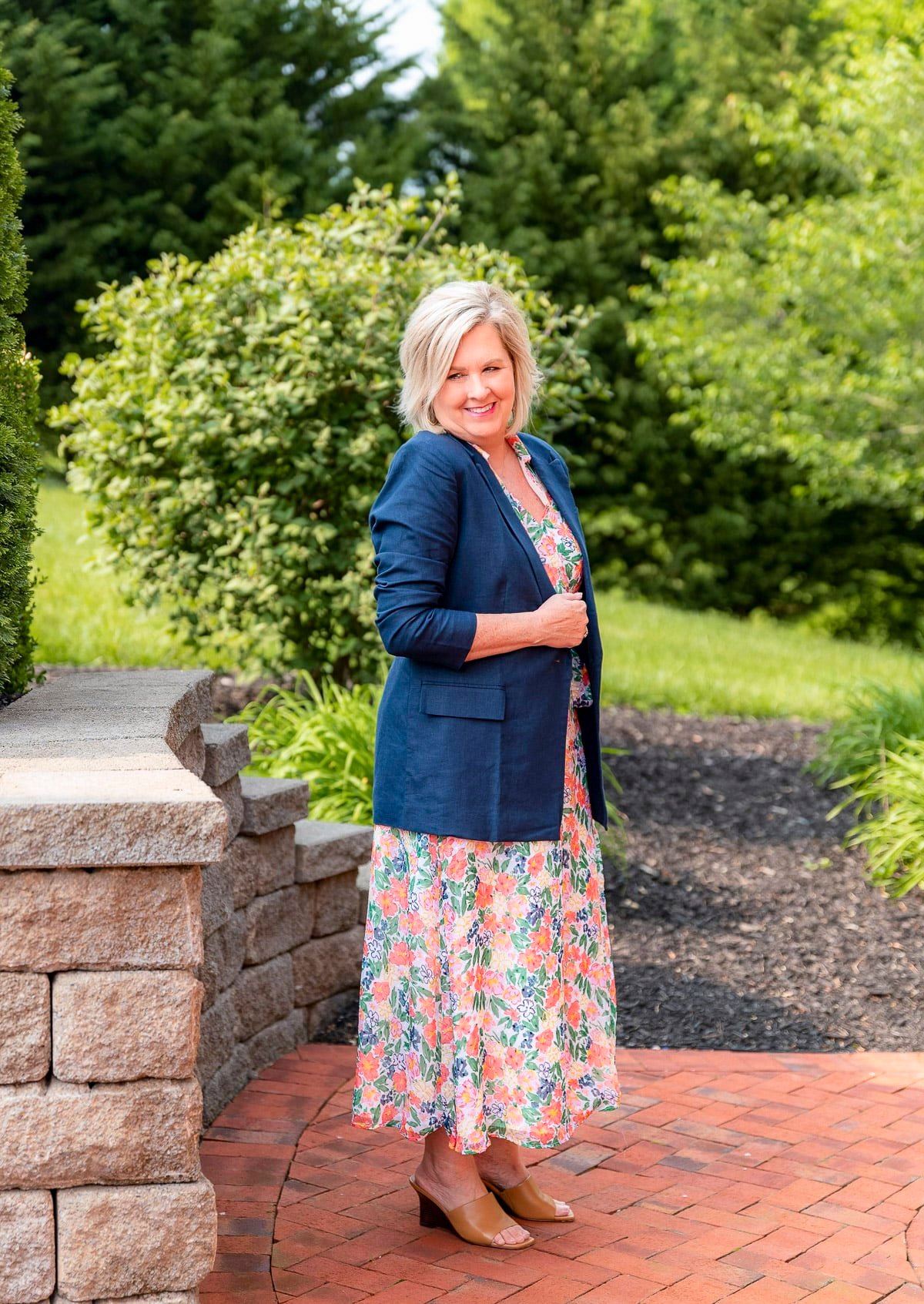 Over 50 Fashion Blogger, Tania Stephens is showing stylish ways to cover flabby arms wearing a dress2