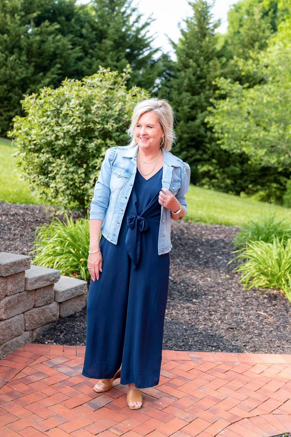 Over 50 Fashion Blogger, Tania Stephens is showing stylish ways to cover flabby arms wearing a jumpsuit21