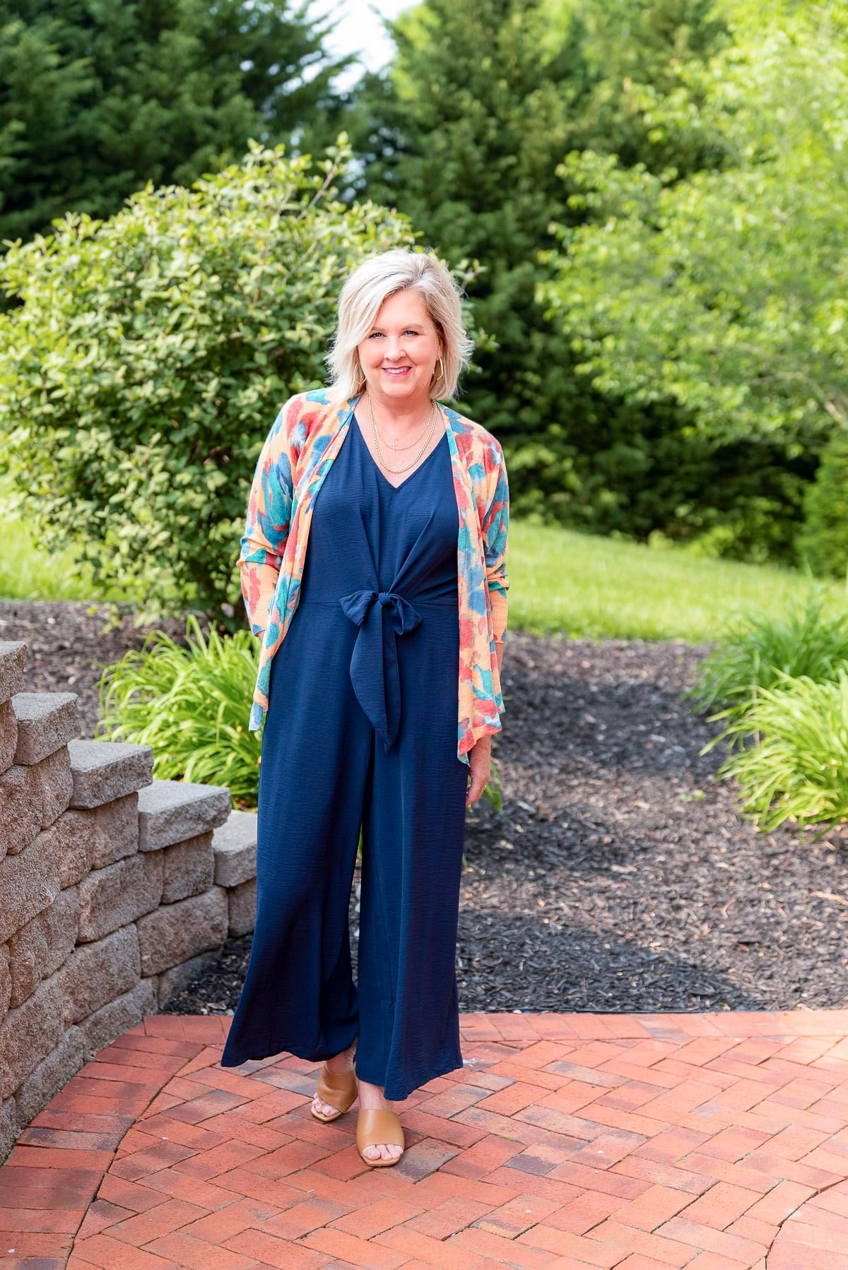 Over 50 Fashion Blogger, Tania Stephens is showing stylish ways to cover flabby arms wearing a jumpsuit8