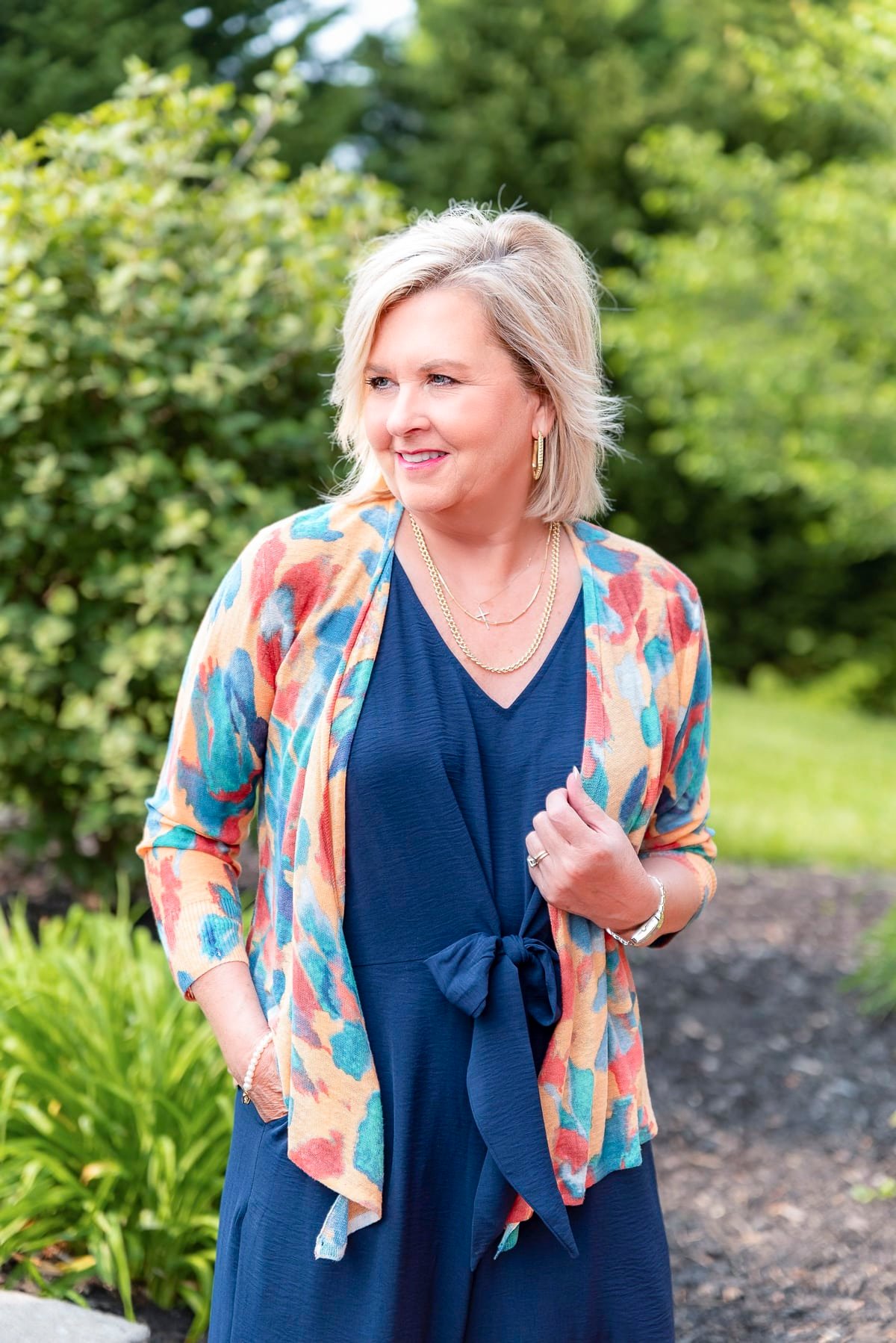 Over 50 Fashion Blogger, Tania Stephens is showing stylish ways to cover flabby arms wearing a jumpsuit9
