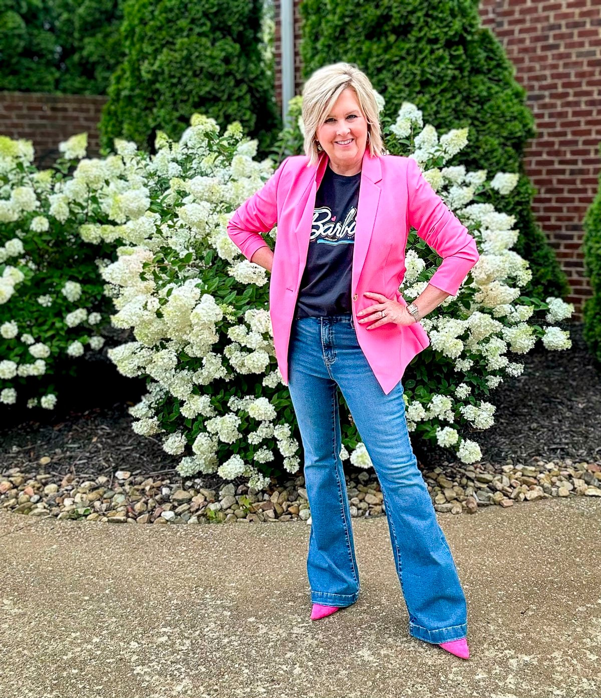 Over 50 Fashion blogger, Tania Stephens, is wearing a Barbie graphic t-shirt from Amazon and a hot pink blazer11