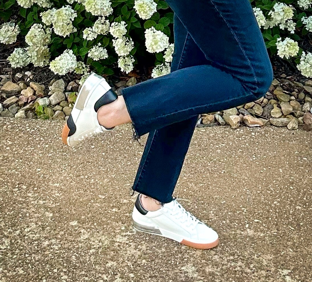 Over 50 Fashion Blogger, Tania Stephens is styling sneakers with jeans