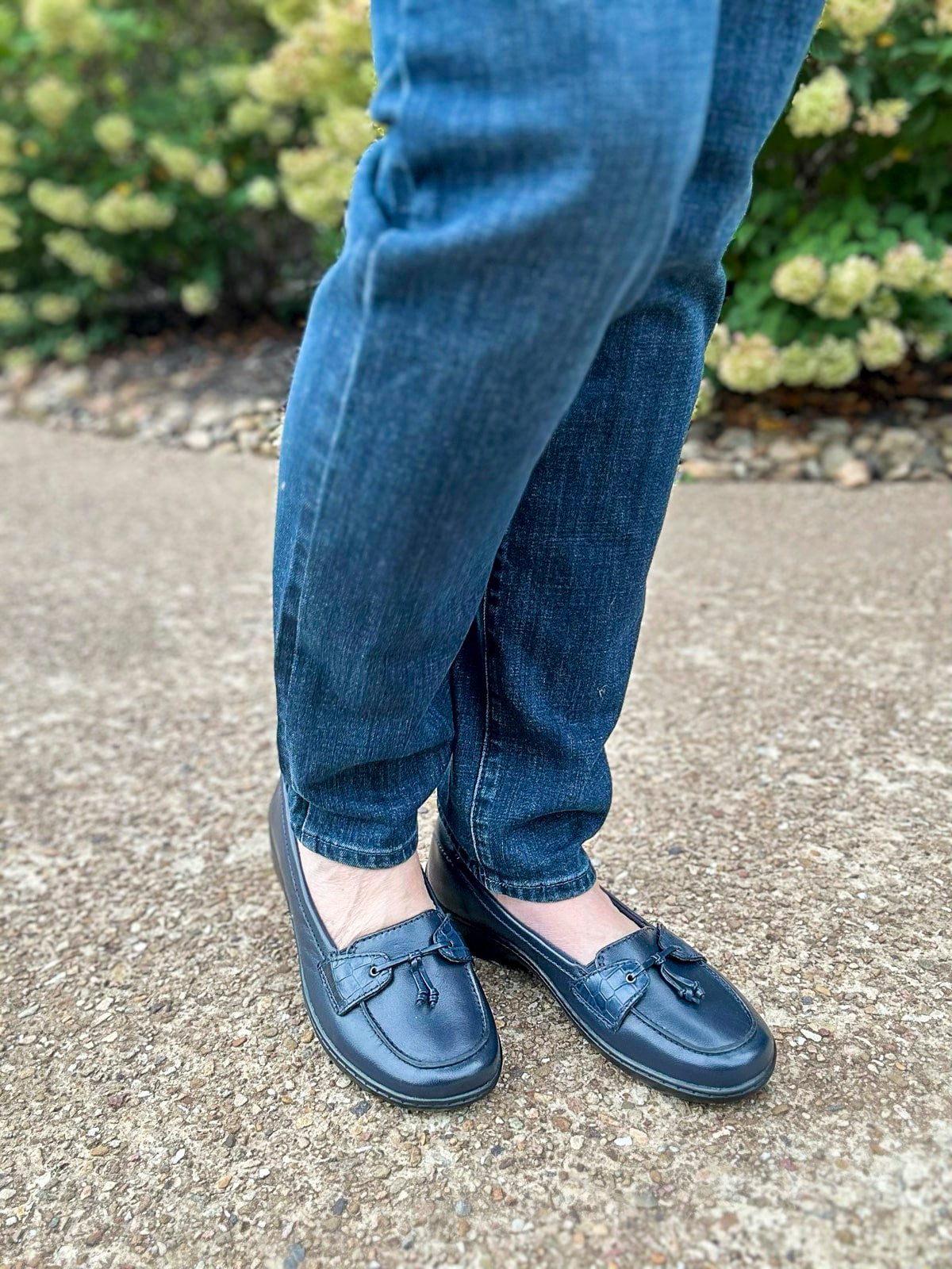 Over 50 Fashion Blogger, Tania Stephens, is wearing a sweater with jeans and a pair of Clarks shoes from DSW4