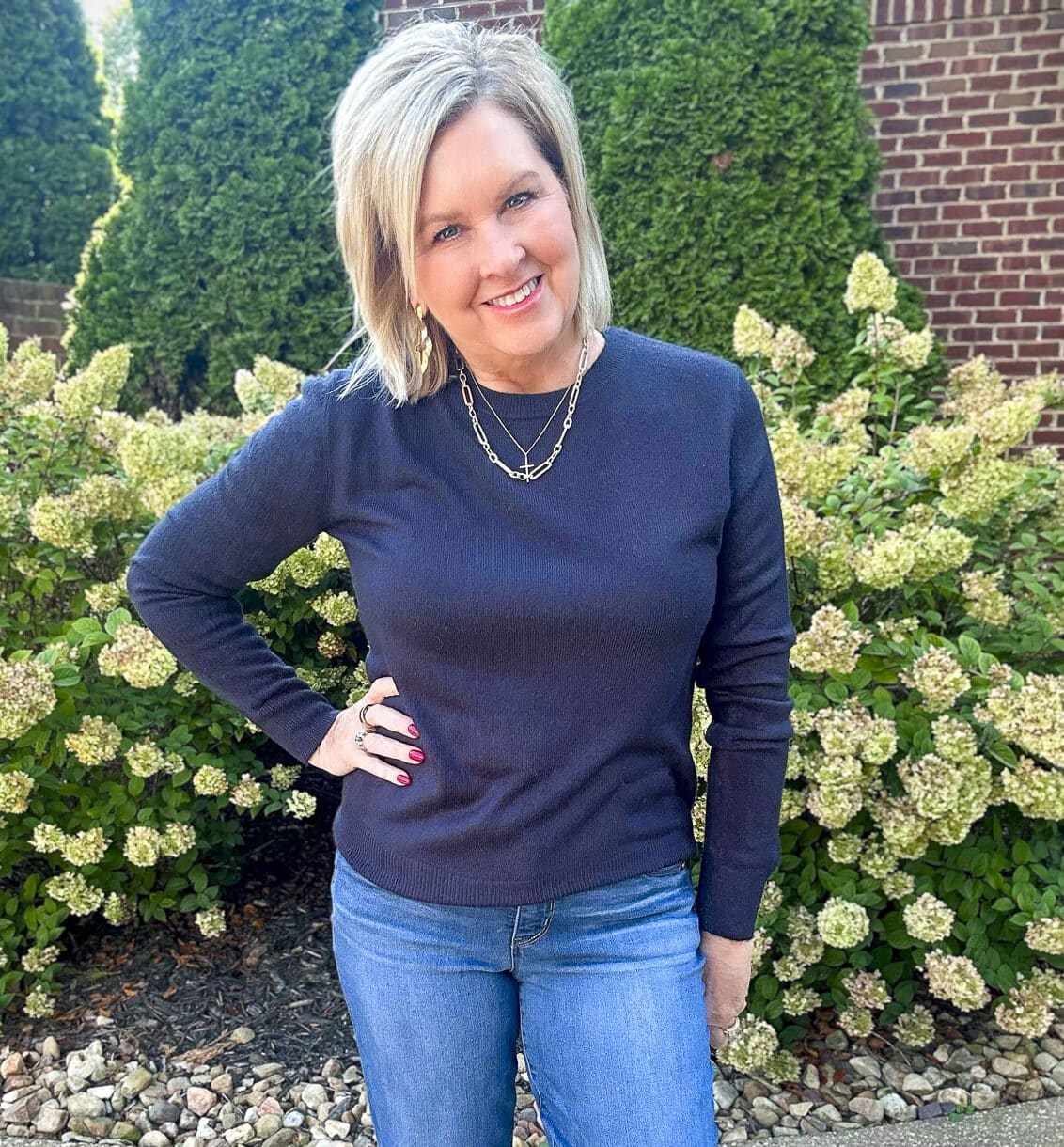 Fashion Blogger Tania Stephens is wearing a navy pullover sweater from Amazon21