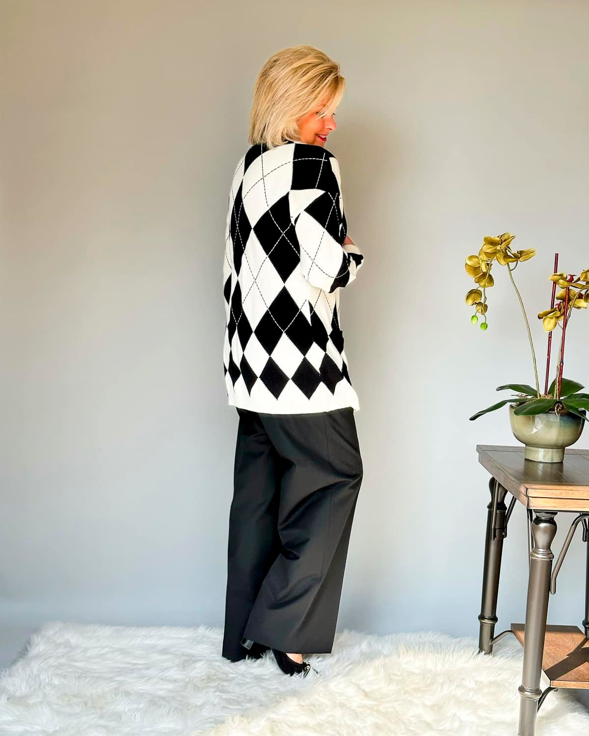 Over 50 Fashion Blogger Tania Stephens is wearing Talbots black pants, a black shell, and a argyle cardigan14