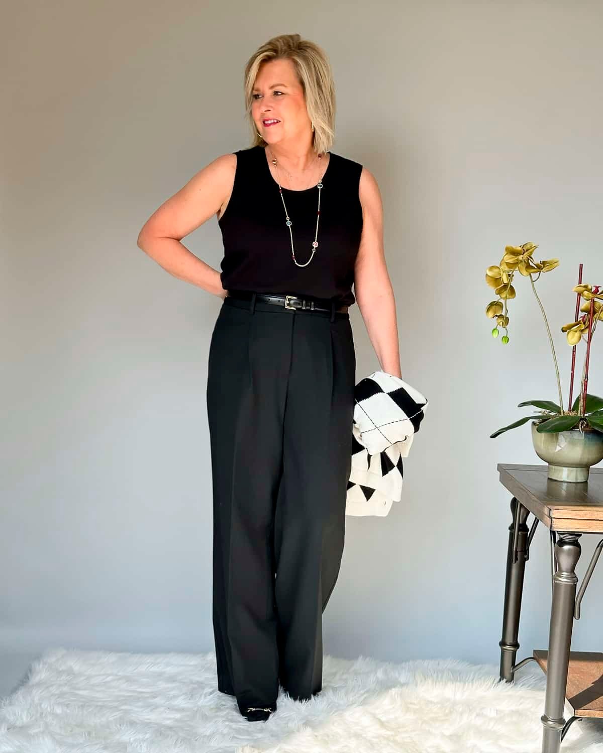 Over 50 Fashion Blogger Tania Stephens is wearing Talbots black pants and a black shell