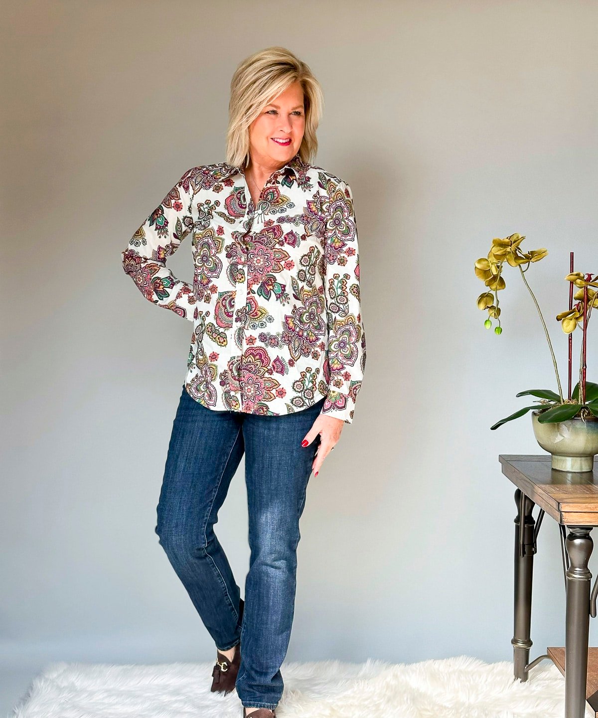 Over 50 Fashion Blogger Tania Stephens is wearing Talbots jeans and a paisley shirt