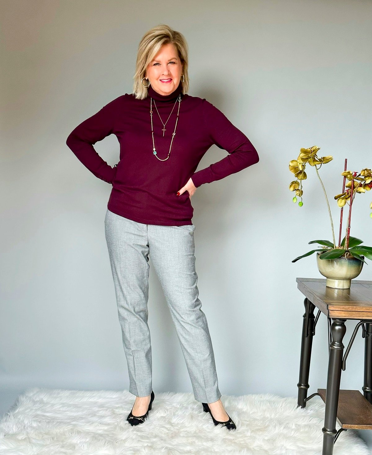 Over 50 Fashion Blogger Tania Stephens is wearing fall style ideas for women over 50 and beyond from  Talbots -  gray pants and a burgundy turtleneck7