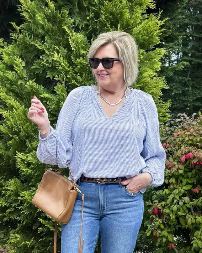 Tania Stephens is wearing a striped henley long sleeve shirt