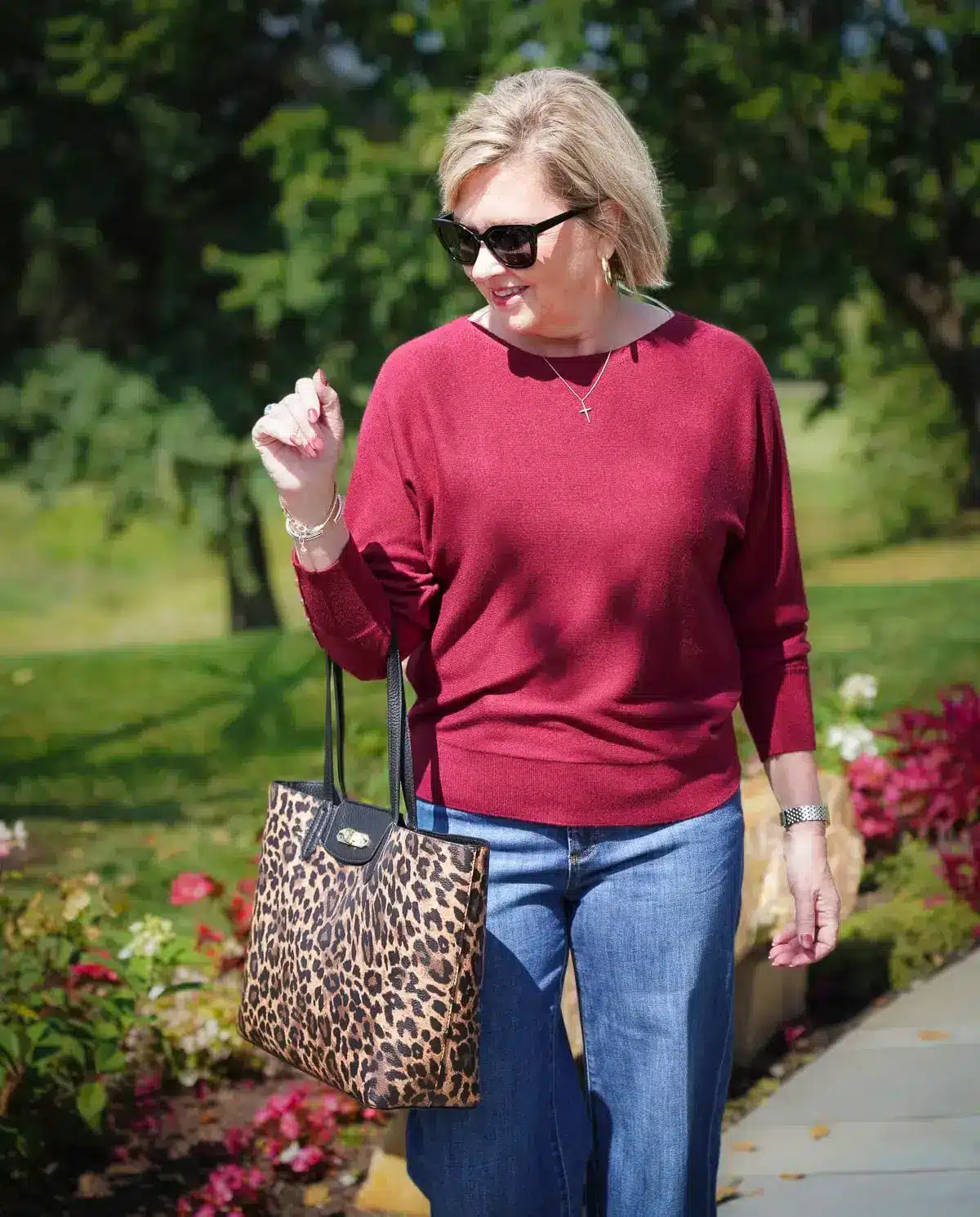 Wine colored dolman pullover sweater with a leopard handbag