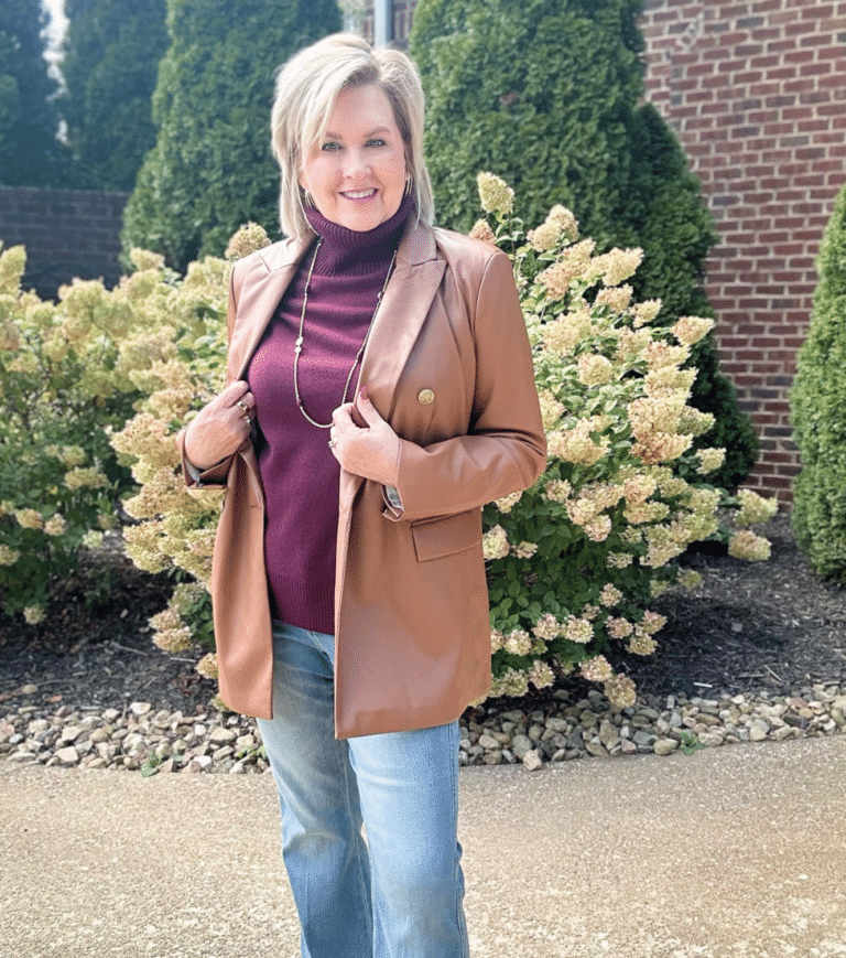 Over 50 Fashion Blogger, Tania Stephens is wearing a faux leather blazer