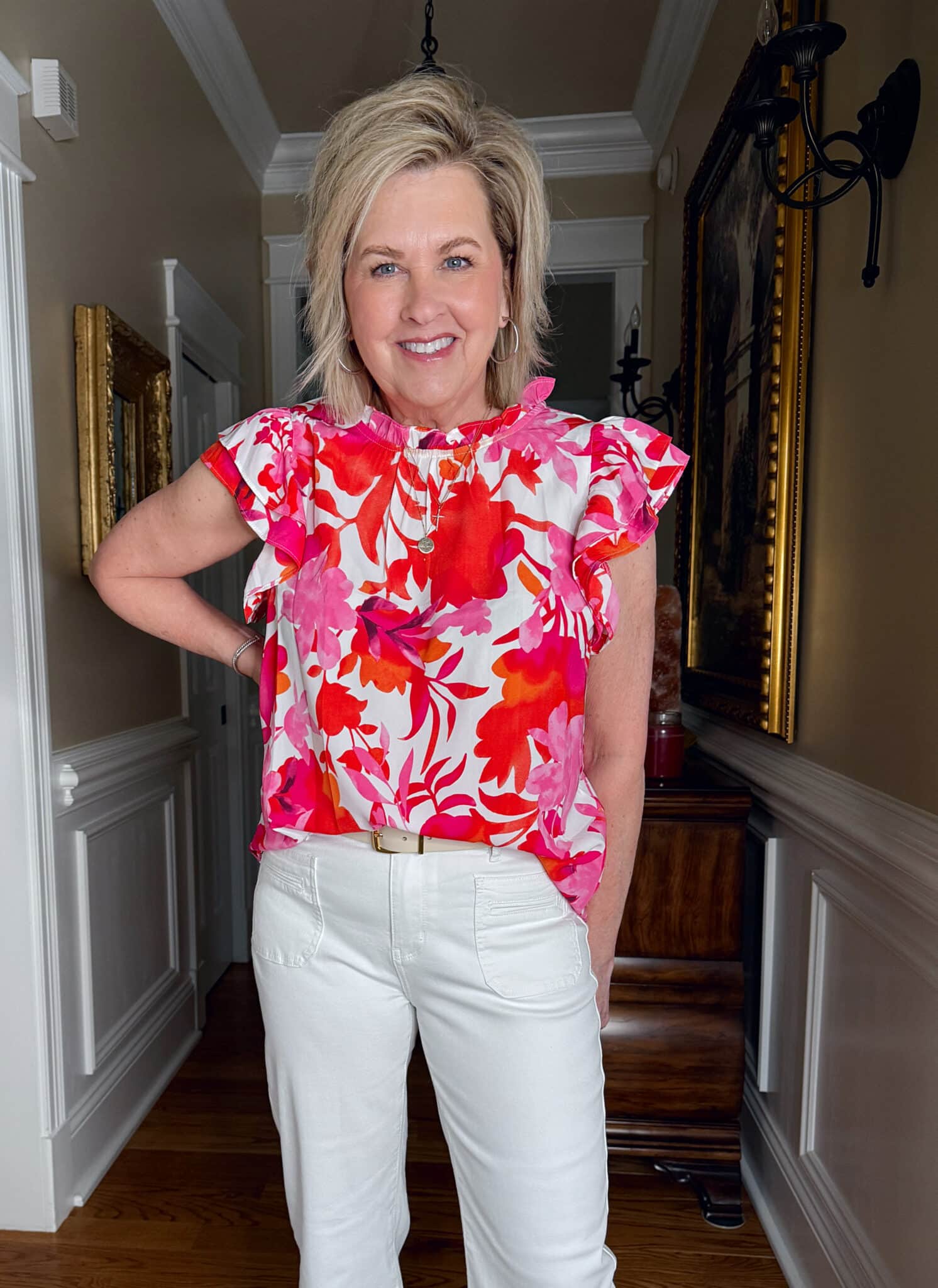 Tania Stephens is wearing a brightly colored flutter sleeve top from Amazon
