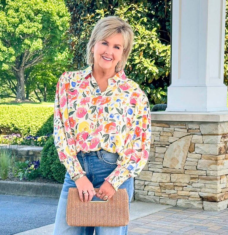 Over 50 Fashion Blogger, Tania Stephens is wearing a shirt with roses and wide leg jeans5
