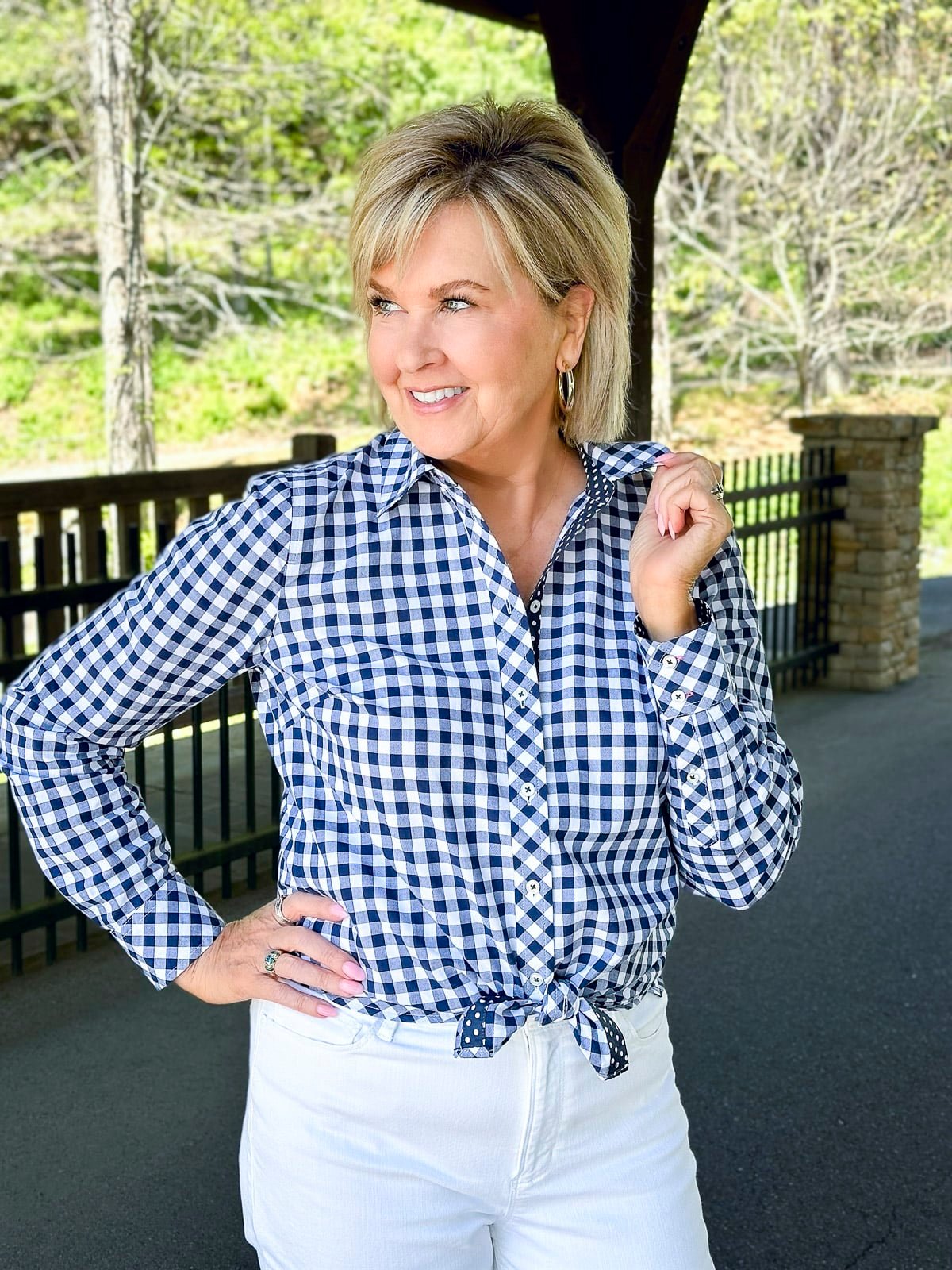Over 50 Fashion Blogger, Tania Stephens is wearing a gingham check shirt with white cuffed jeans9