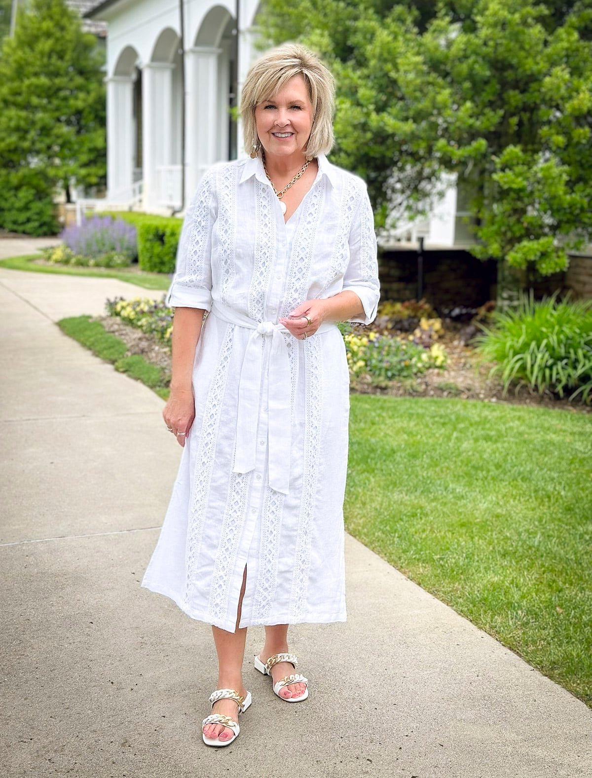 Fashion Blogger, Tania Stephens is wearing a short sleeve white dress from Chico's