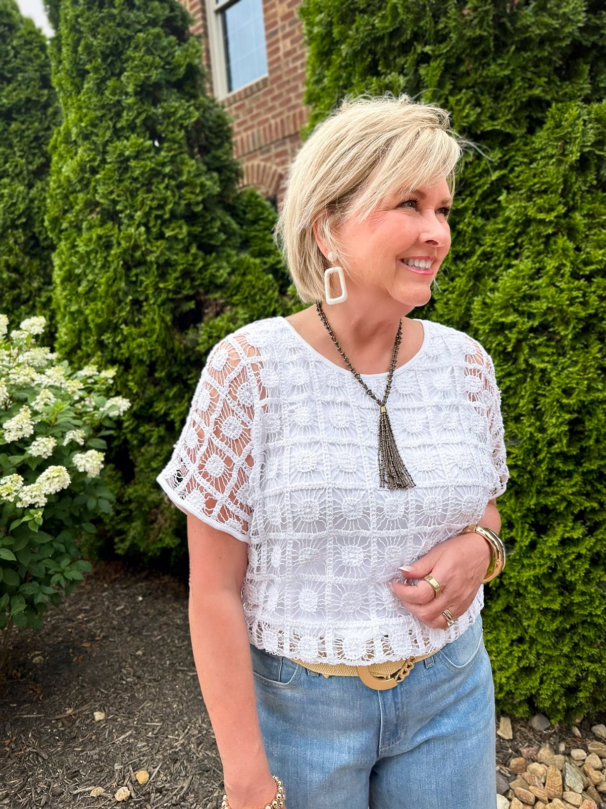 Over 50 Fashion Blogger Tania Stephens is styling a crochet top and jeans from Chico's34