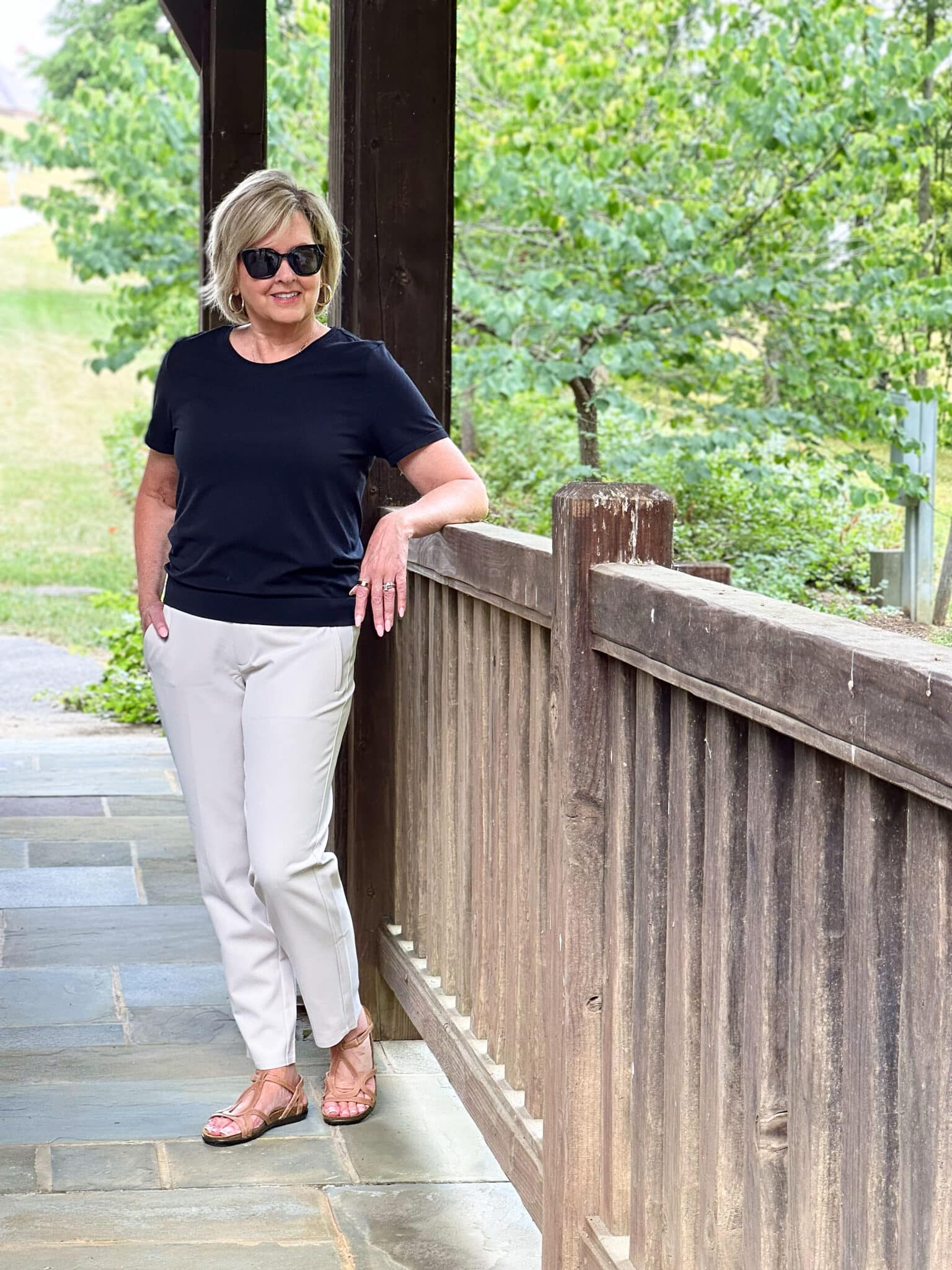 Over50 Fashion Blogger, Tania Stephens, is wearing a black tee and Endless pants from Athleta