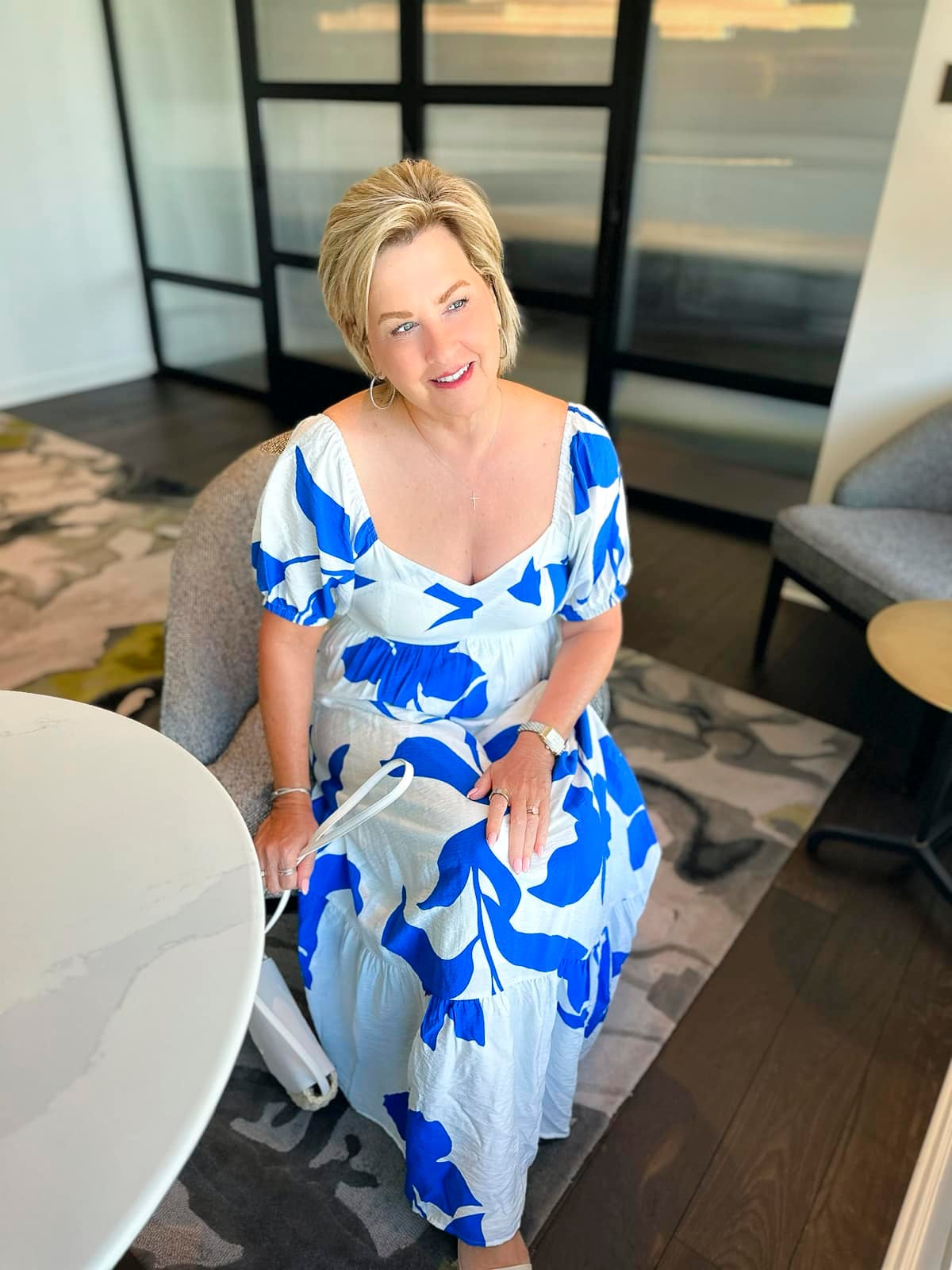 Over 50 fashion blogger, Tania Stephens is wearing a blue and white  sundress from Kohl's1