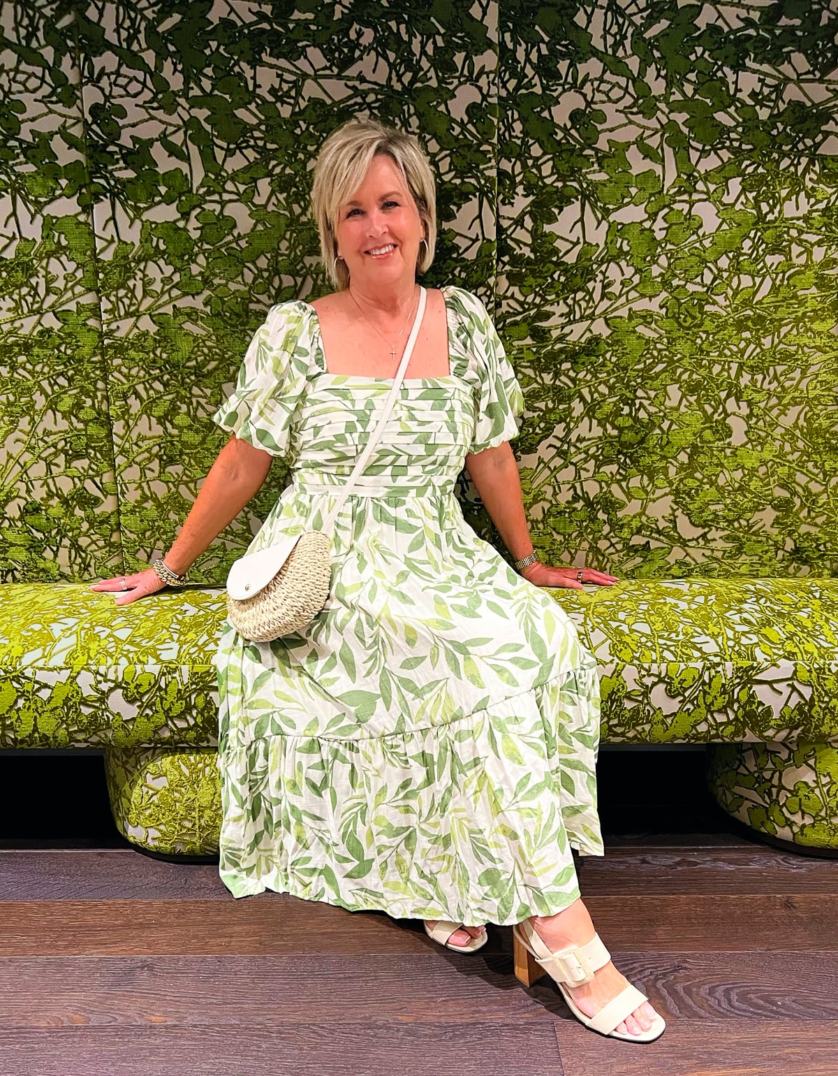 Over 50 fashion blogger, Tania Stephens is wearing a green and white leaf print sundress from Kohl's25