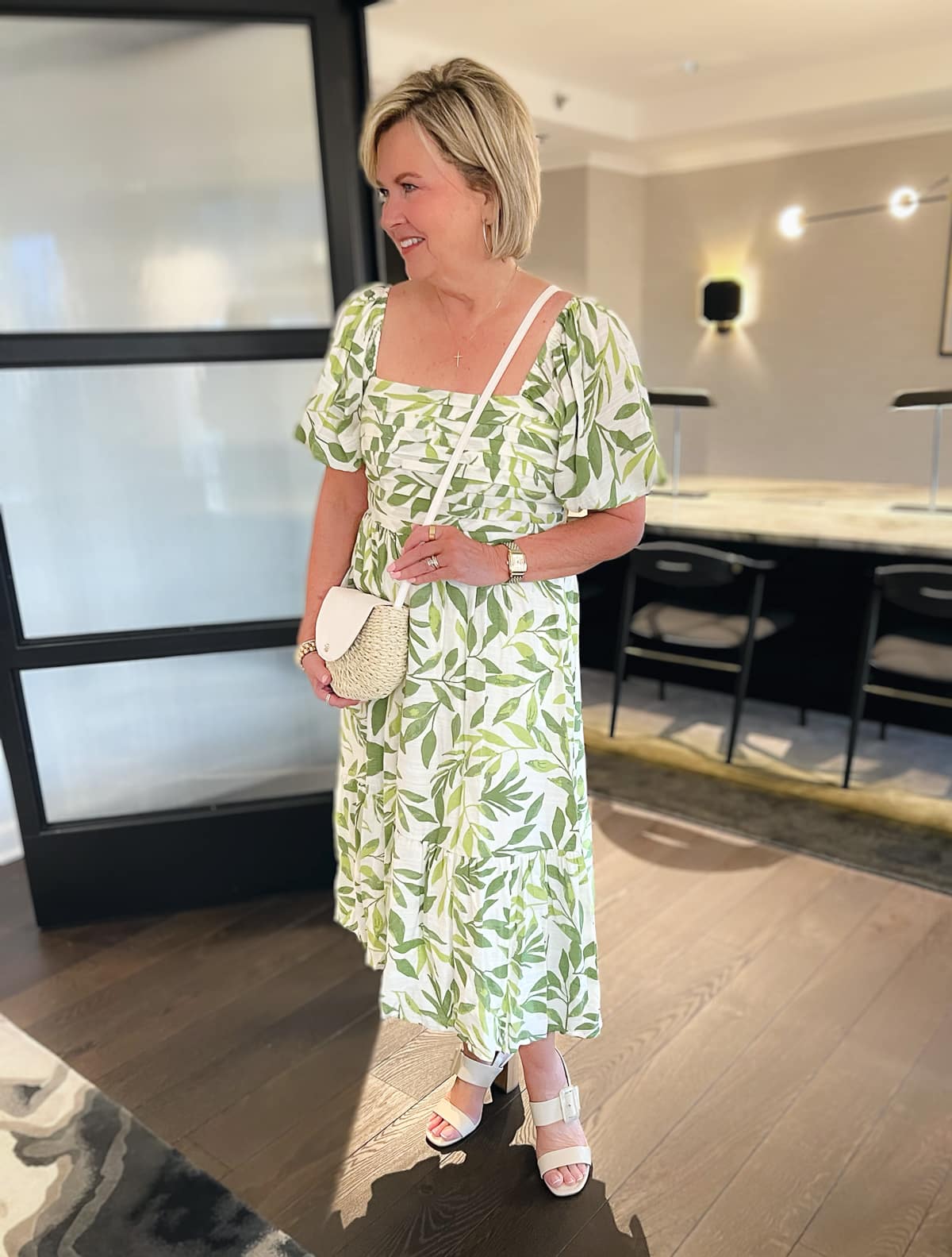 Over 50 fashion blogger, Tania Stephens is wearing a green and white leaf print sundress from Kohl's27