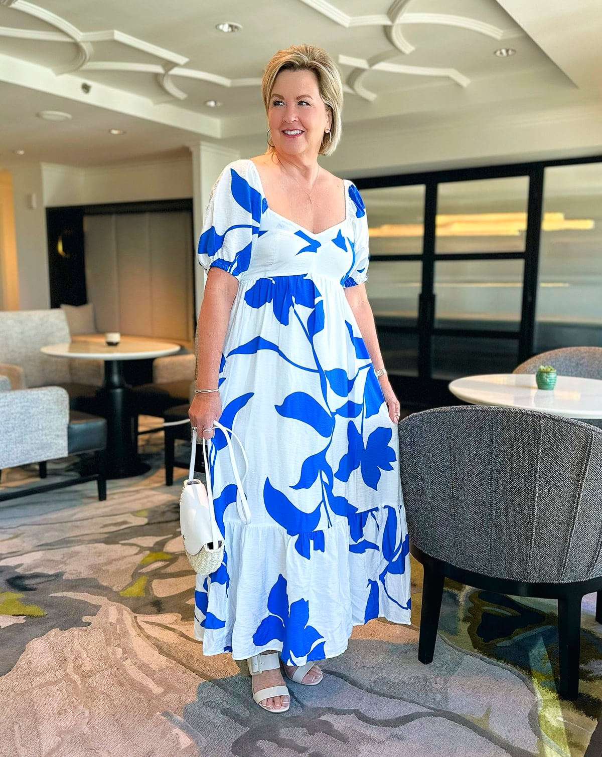 Over 50 fashion blogger, Tania Stephens is wearing a white and blue sundress from Kohl's3