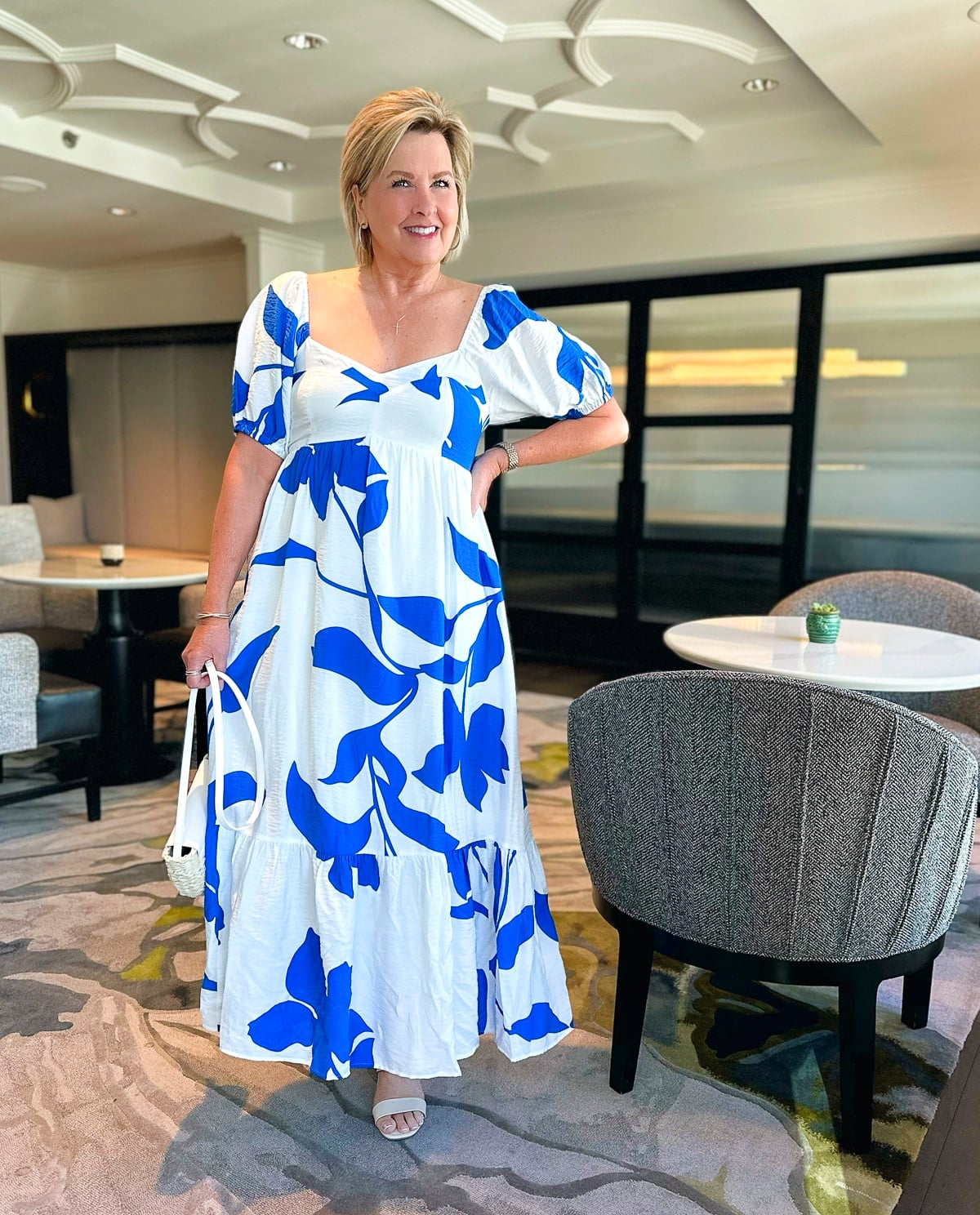 Over 50 fashion blogger, Tania Stephens is wearing a white and blue sundress from Kohl's5