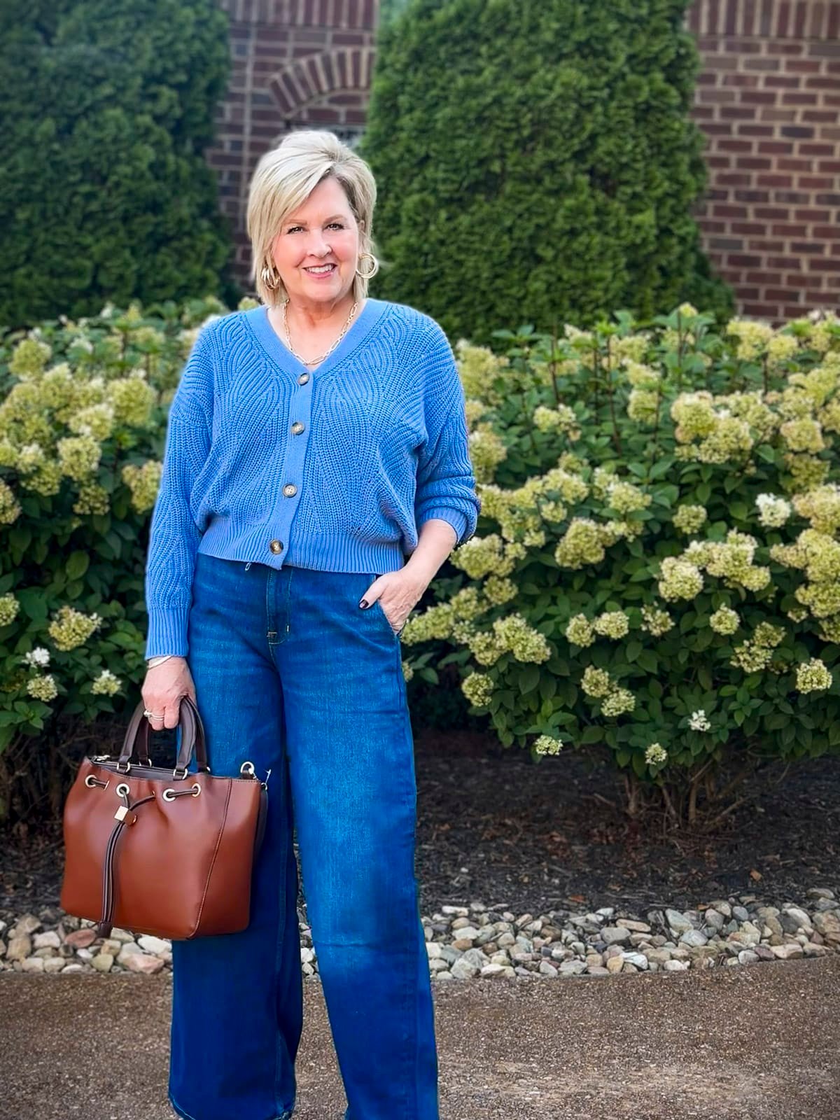 Tania Stephens is wearing fall styles from Walmart - a blue cardigan and wide leg jeans11