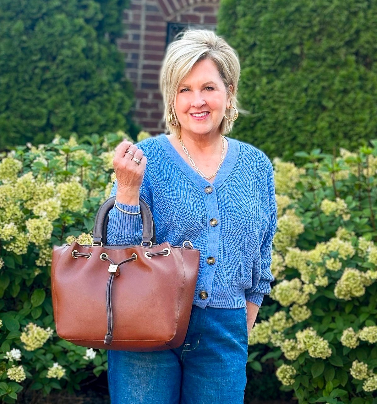 Tania Stephens is wearing fall styles from Walmart - a blue cardigan and wide leg jeans13