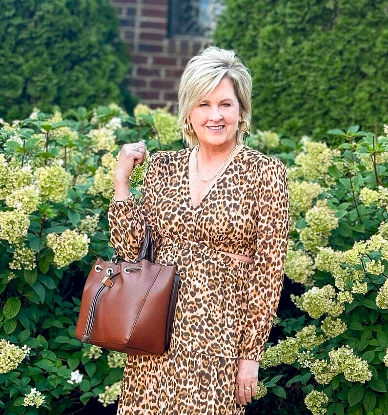 Tania Stephens is wearing fall styles from Walmart - a leopard print midi dress and burgundy knee boots25