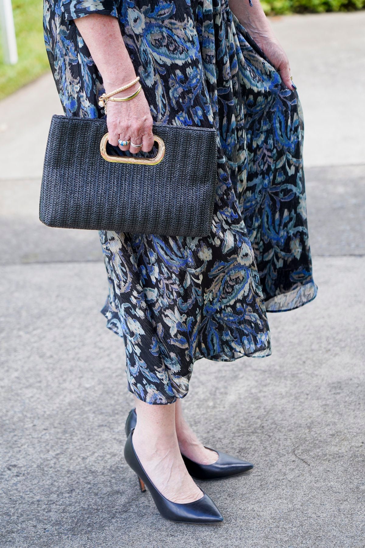 Tania Stephens is wearing a blue floral fall wedding guest dress from Nordstrom23