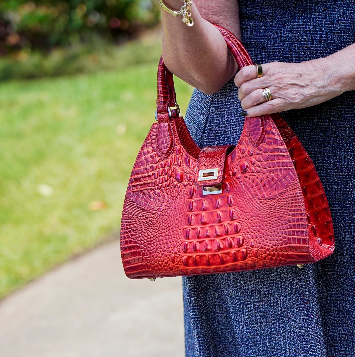 Tania Stephens is wearing a blue tweed fit and flare floral fall wedding guest dress from Nordstrom45