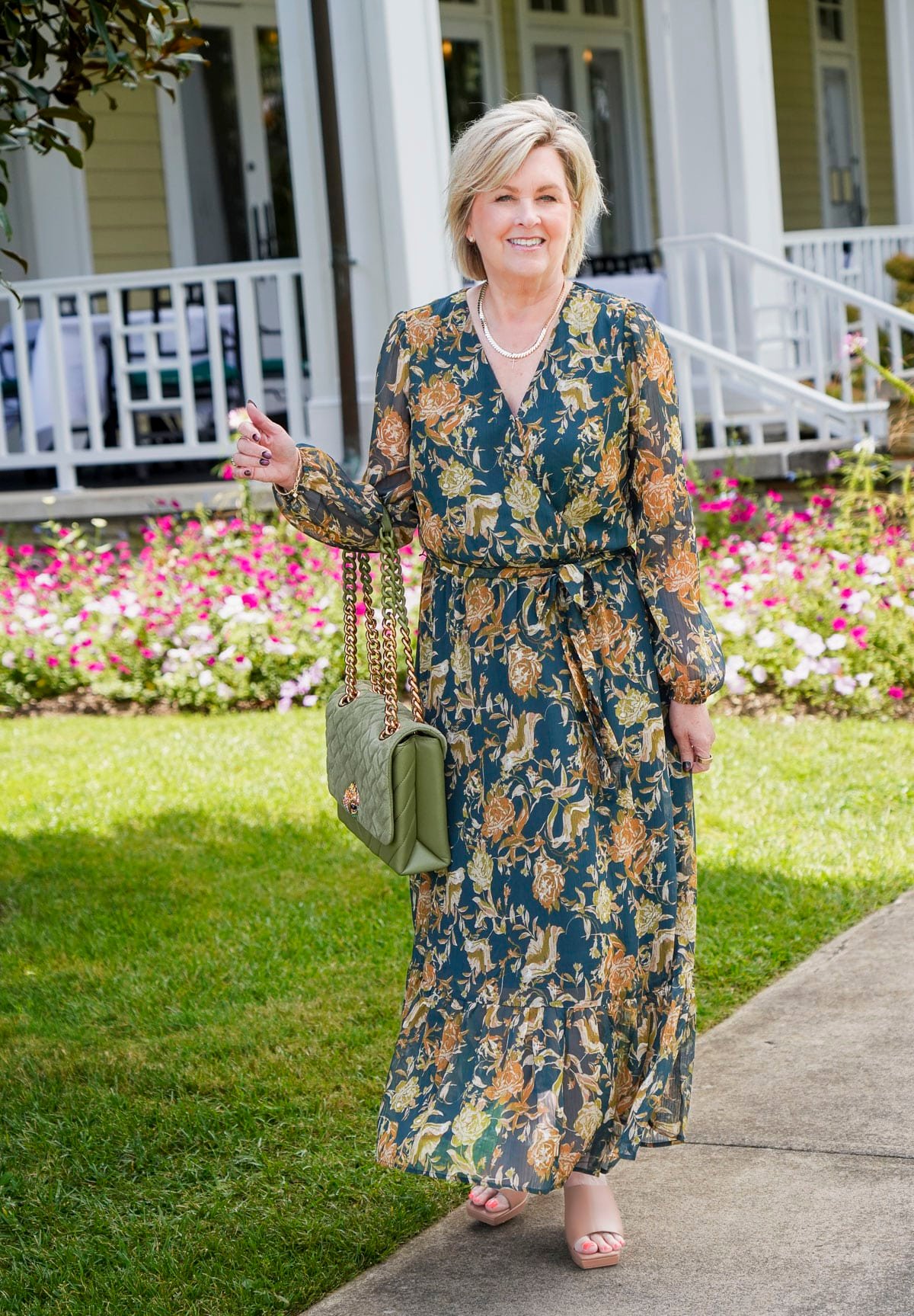Tania Stephens is wearing a deep green fall wedding guest dress from Nordstrom8