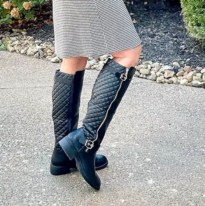 Tania Stephens wearing black quilted boots