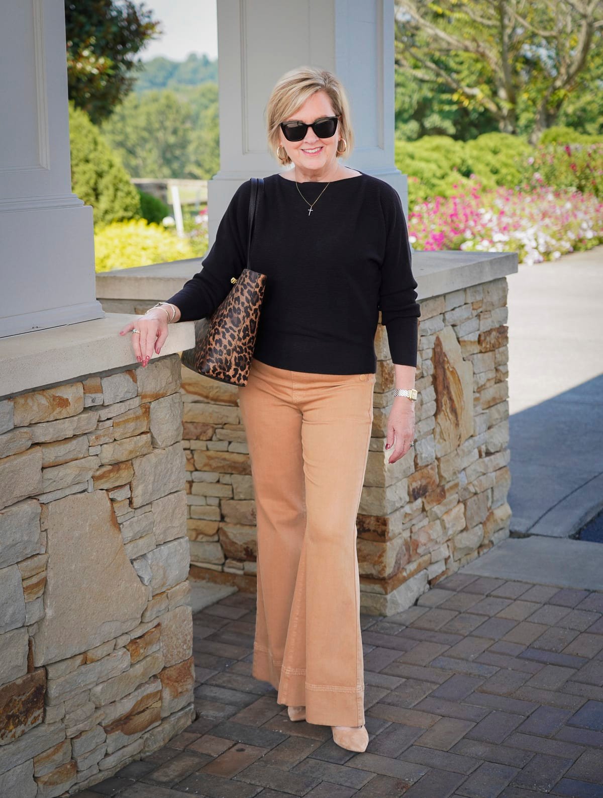 Tania Stephens is wearing brown flare pants from Chicos