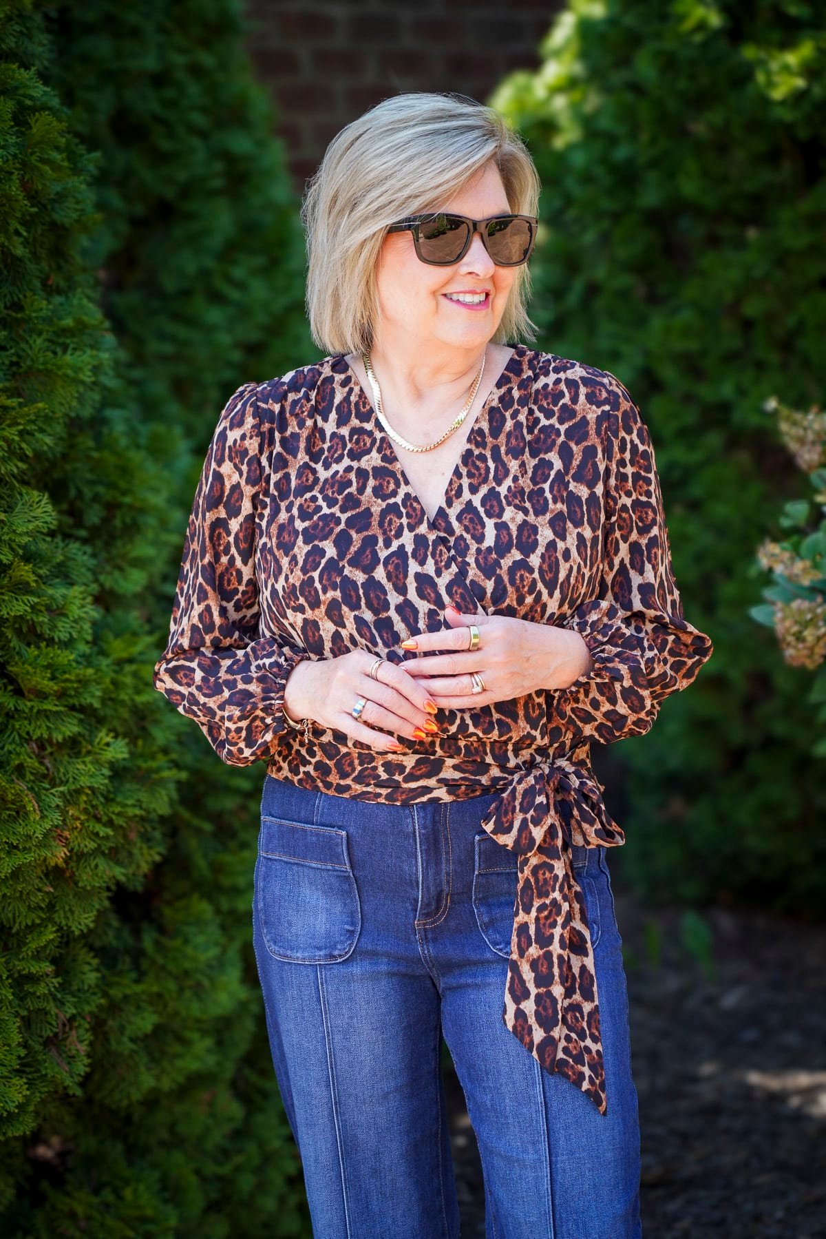 Tania Stephens is wearing a leopard print blouse and jeans14