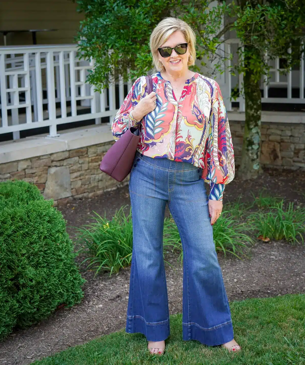 Tania Stephens wearing a lantern sleeve blouse and wide leg jeans