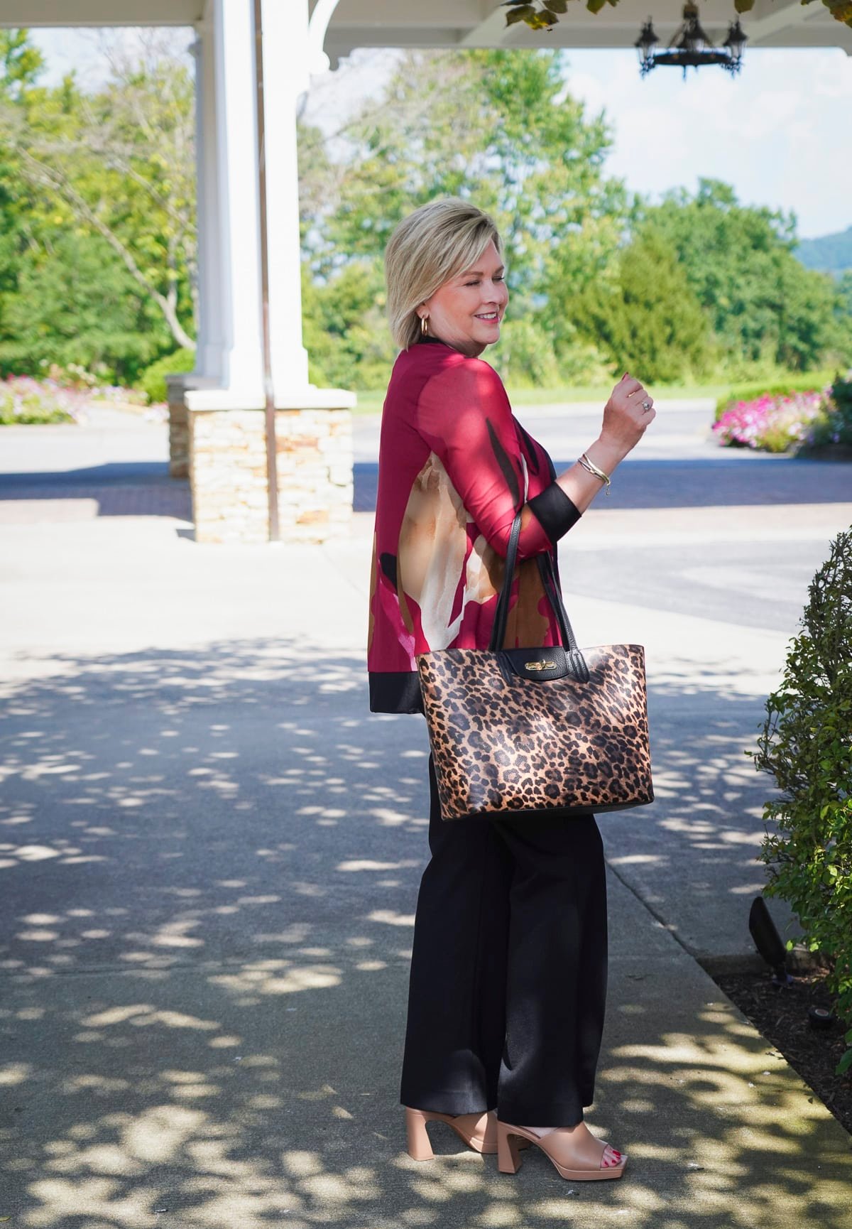 Tania Stephens is styling Fall 2024 New Arrivals From Chicos - burgundy tank and cardigan with black dress pants`15