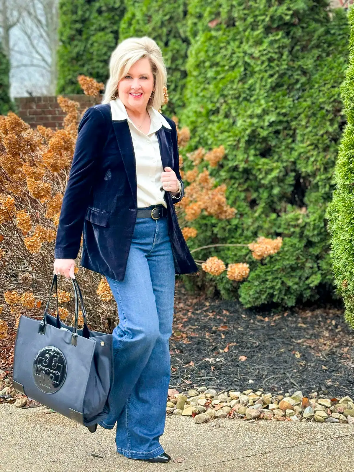 Tania Stephens is carrying an Ella Nylon Tory Burch tote