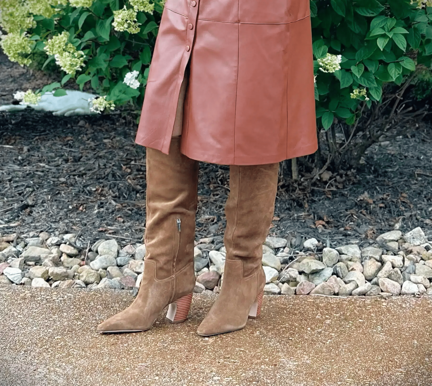 Tania Stephens is wearing brown knee high chunky heel boots