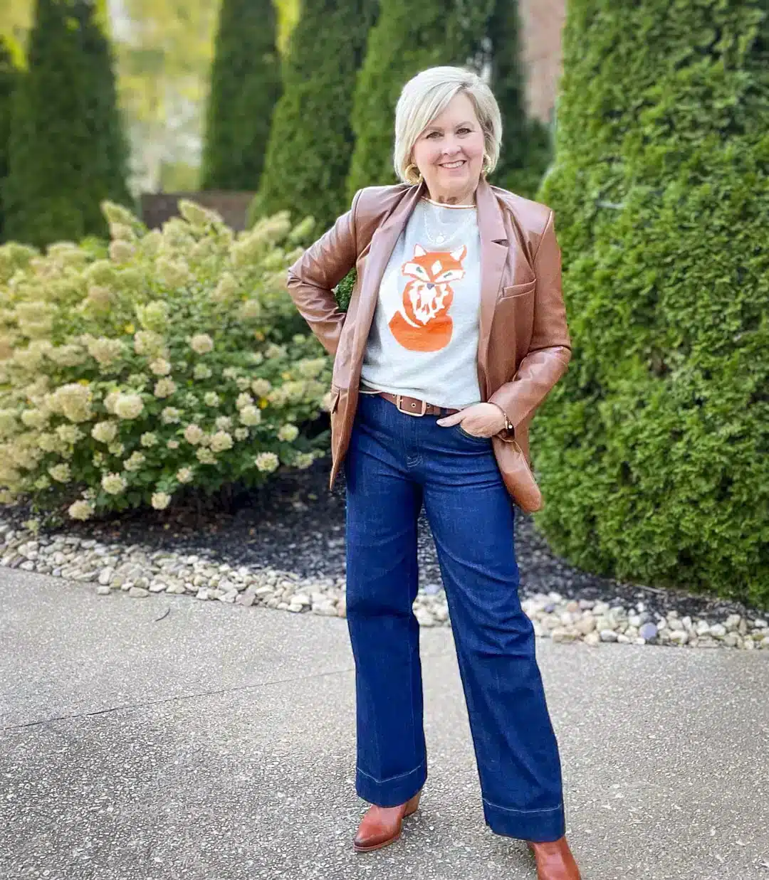 Tania Stephens wearing a fox sweater and trousers