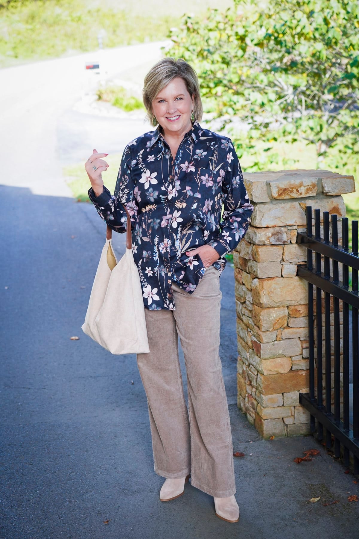 Tania Stephens i wearing a floral button up shirt and corduroy pants during a Coldwater Creek Try On Haul for fall
